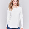 Ecru knit sweater with a crew neckline, long ribbed sleeves, and back lace-up eyelet details by Charlie B.