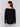 Black knit sweater with a crew neckline, long ribbed sleeves, and back lace-up eyelet details by Charlie B.