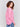 Magenta pink long-sleeved knit sweater with lace-up cuffs, rounded hem, and front pockets by Charlie B.