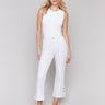 White pants with lace cut sides and a stretch twill fabric by Charlie B.