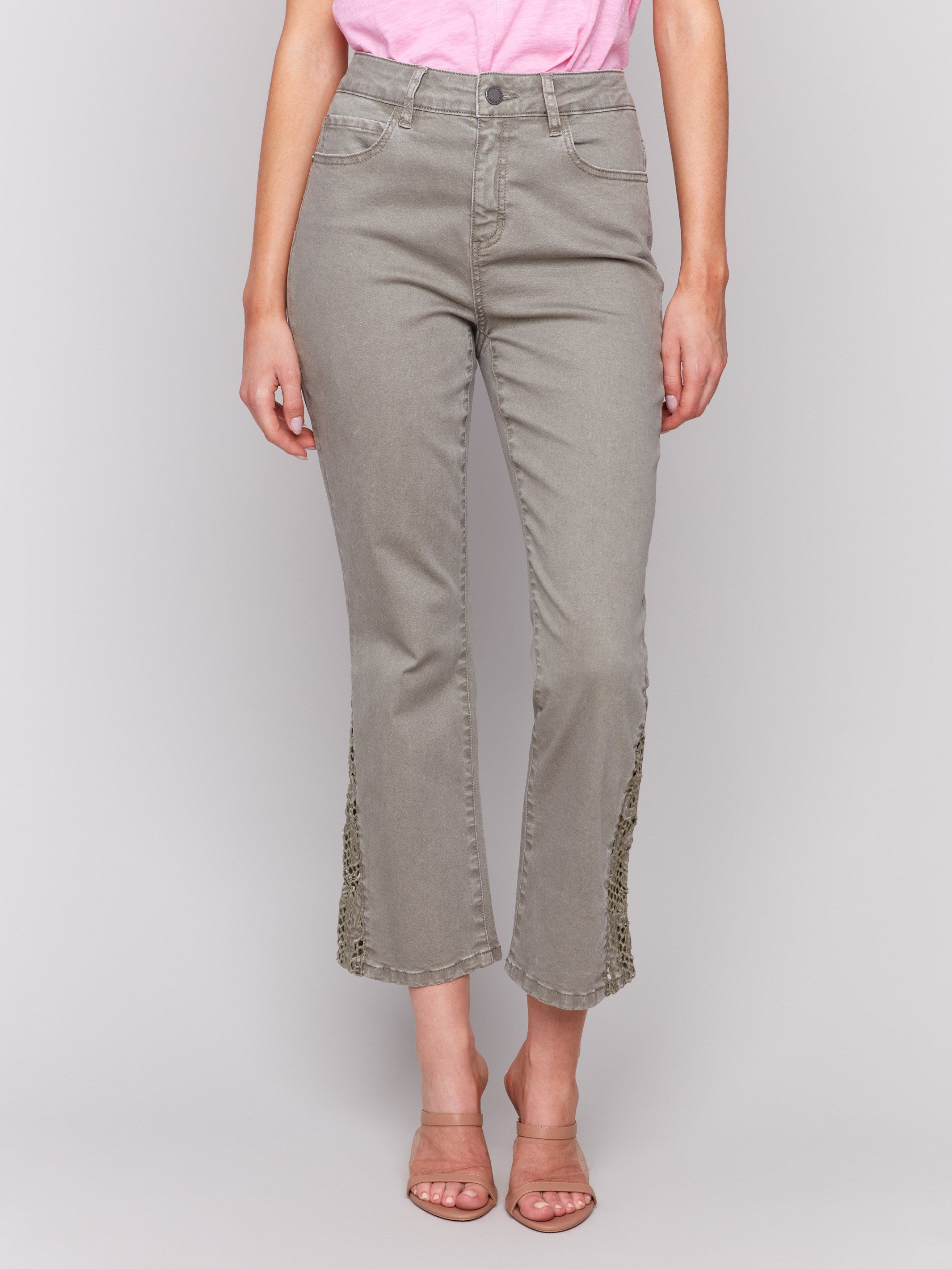 Ankle-length celadon pants featuring intricate lace cuts by Charlie B.