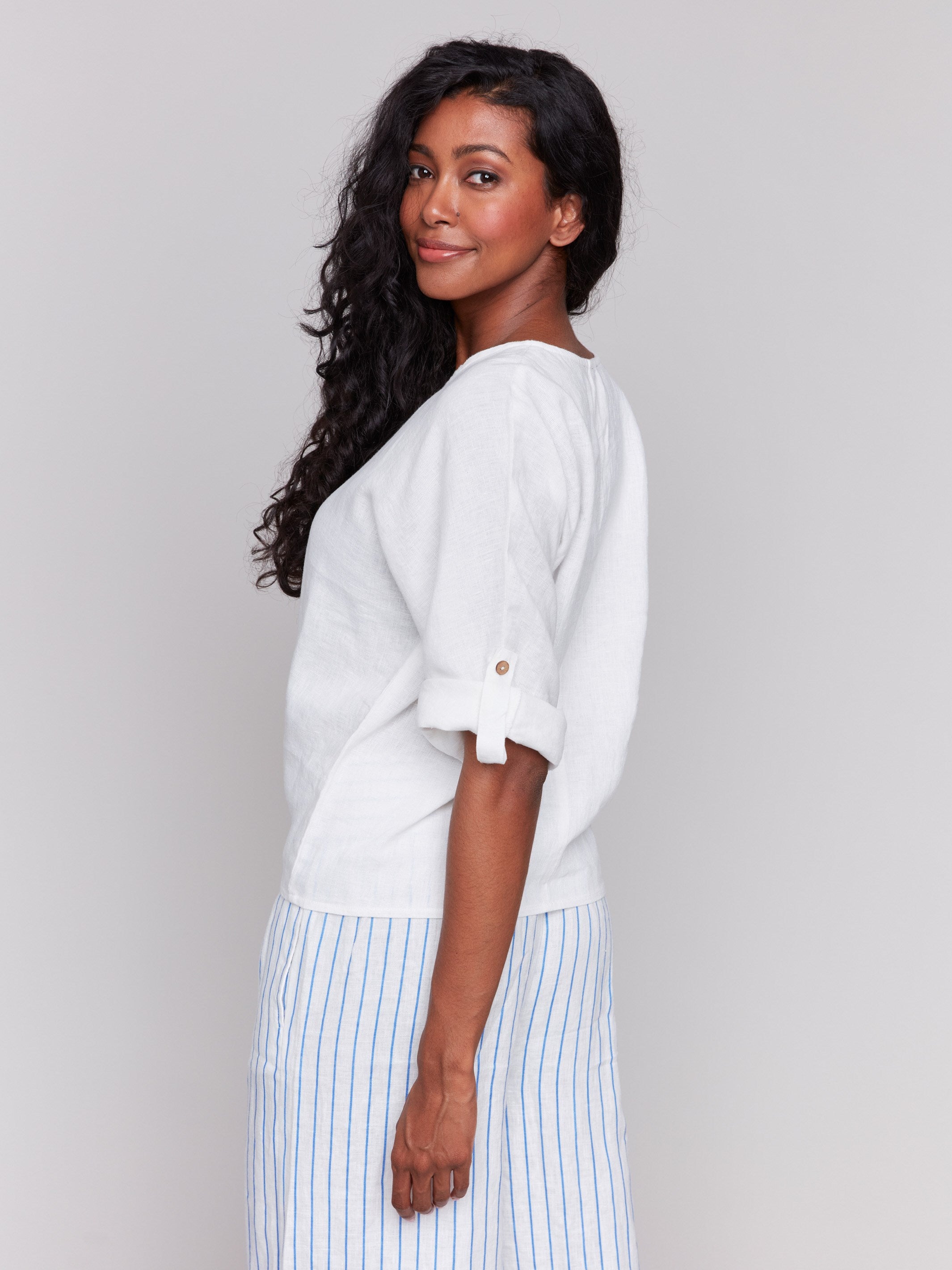 Elegant white top with roll-up 3/4 sleeves by Charlie B.