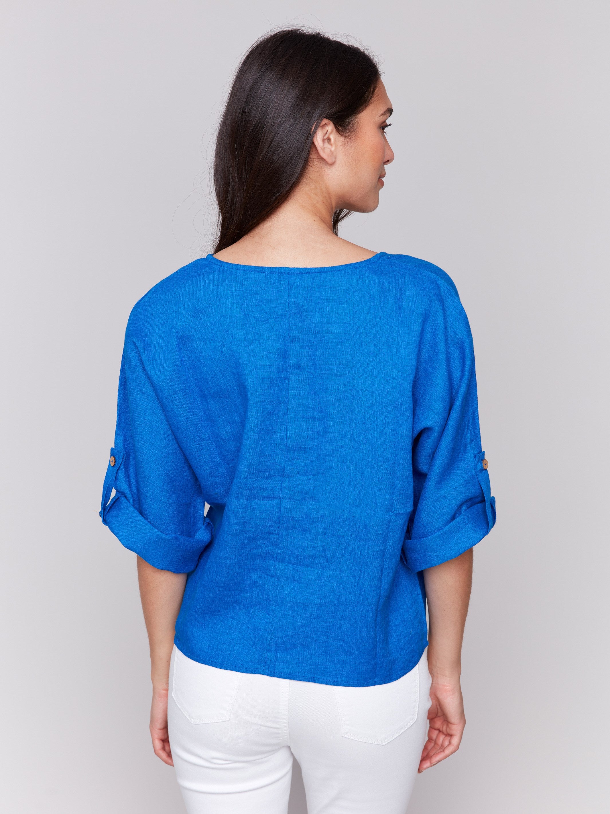 Stylish blue linen blend top with modern design elements by Charlie B.