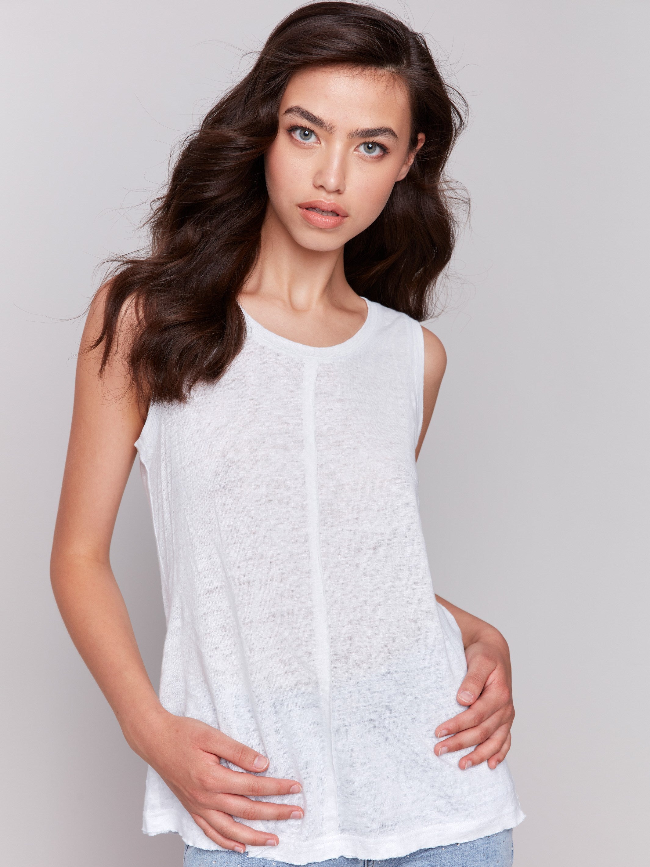 Elegant linen blend top in white with unique design elements by Charlie B.