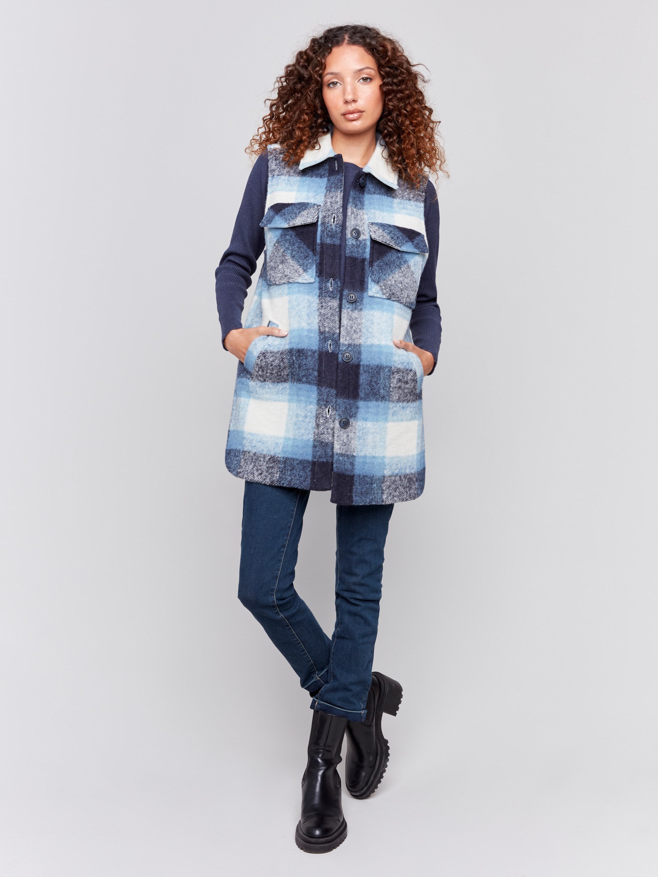 Long plaid boiled wool vest with a button front and large flap pockets by Charlie B.