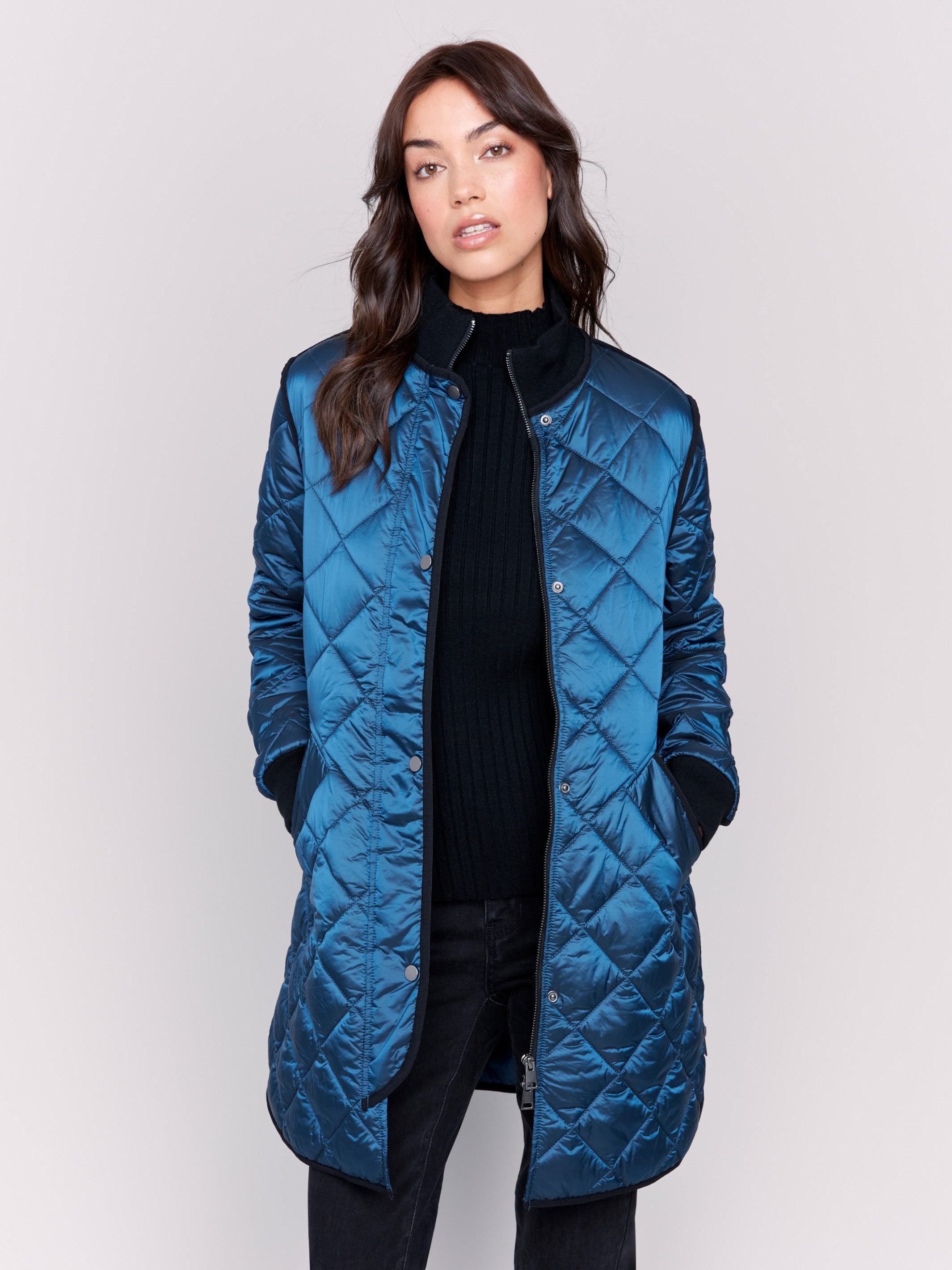 Long blue quilted puffer jacket with zipper front and rib knit collar and cuffs by Charlie B.