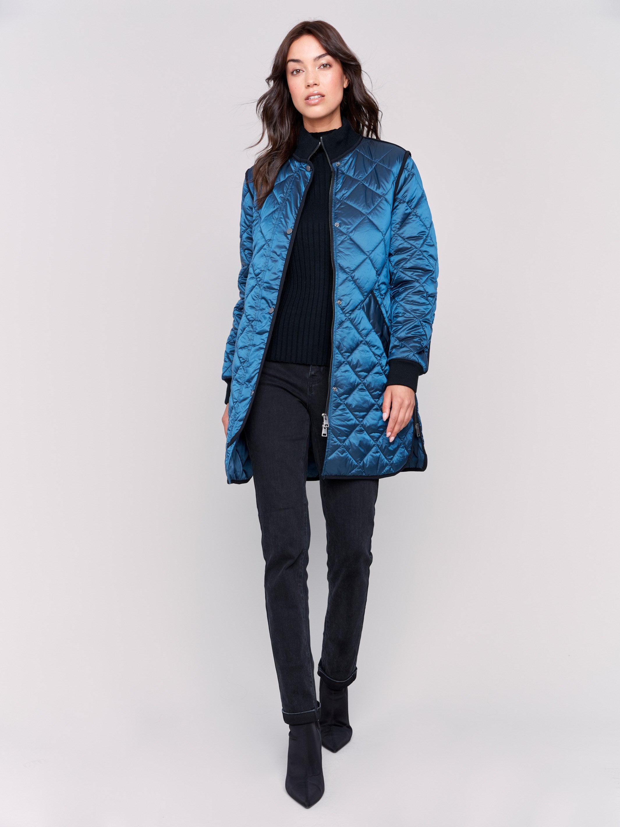 Long blue quilted puffer jacket with zipper front and rib knit collar and cuffs by Charlie B.