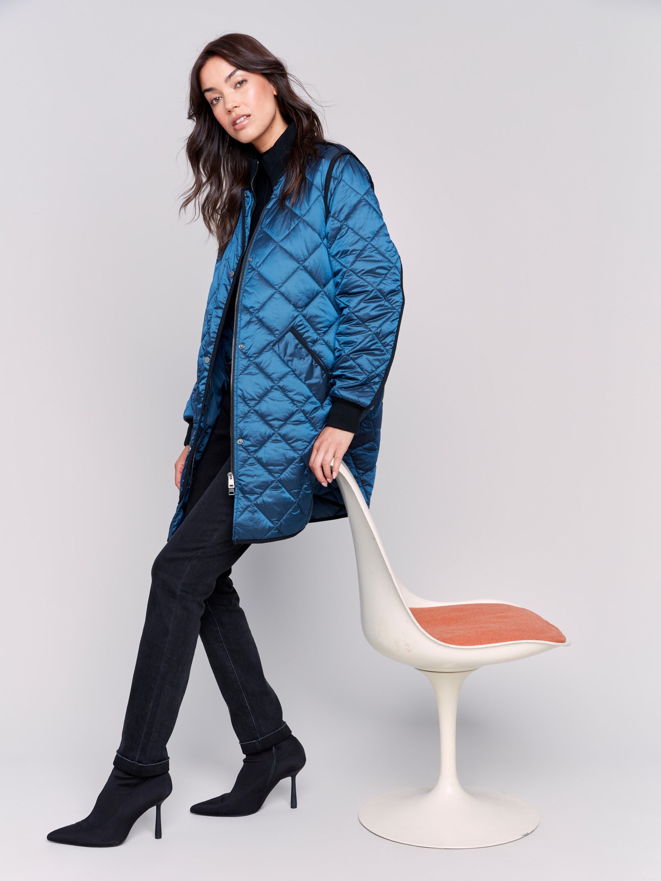 Long blue quilted puffer jacket with zipper front and rib knit collar and cuffs by Charlie B.