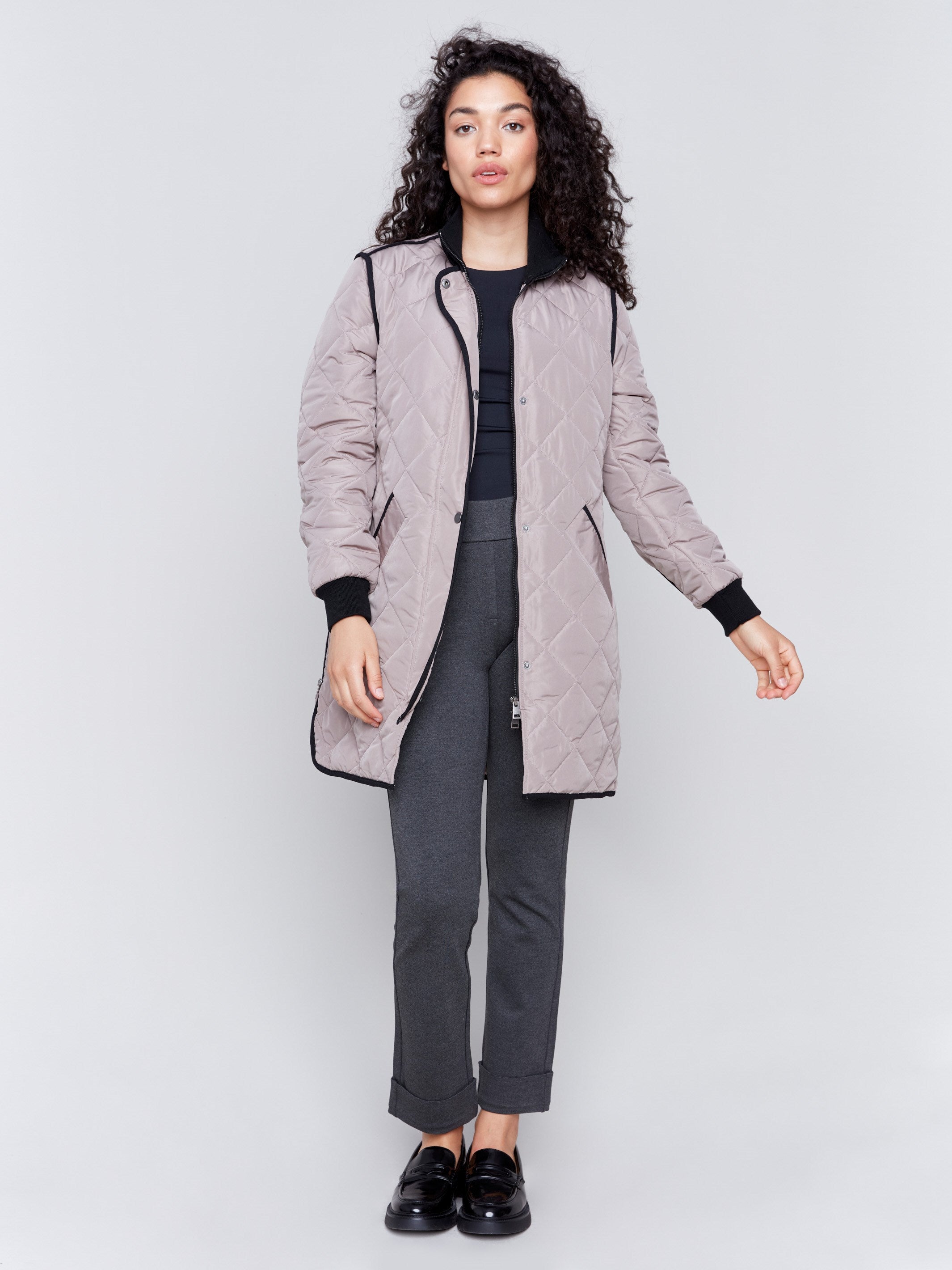 Taupe long quilted puffer jacket with rib knit detail, zipper front, and front pockets by Charlie B.