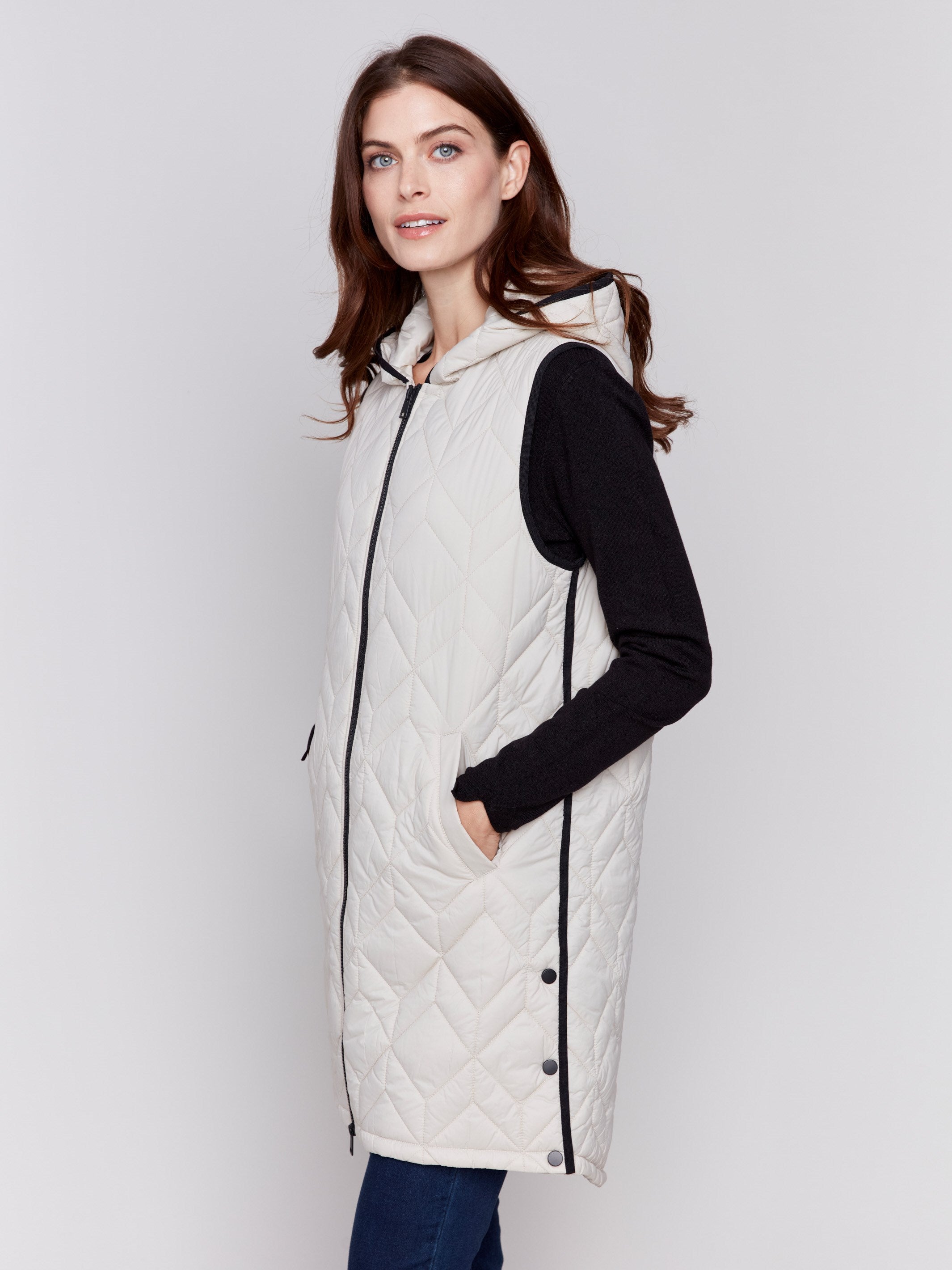 Almond beige long quilted puffer vest with zip closure and hood by Charlie B.