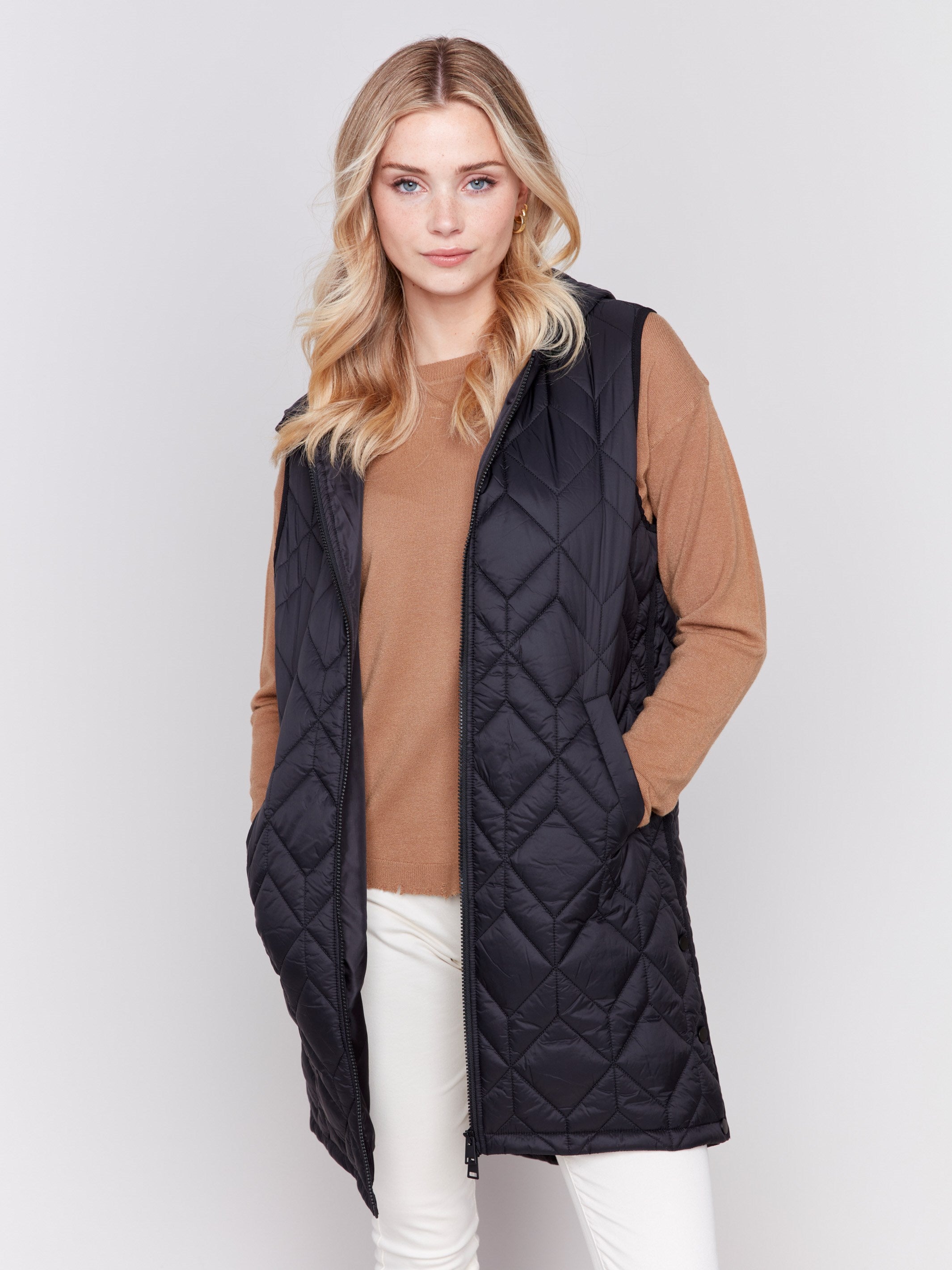 Black long quilted puffer vest with zip closure and hood by Charlie B.