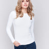 White long-sleeve top with crew neckline, featuring a fitted silhouette by Charlie B.