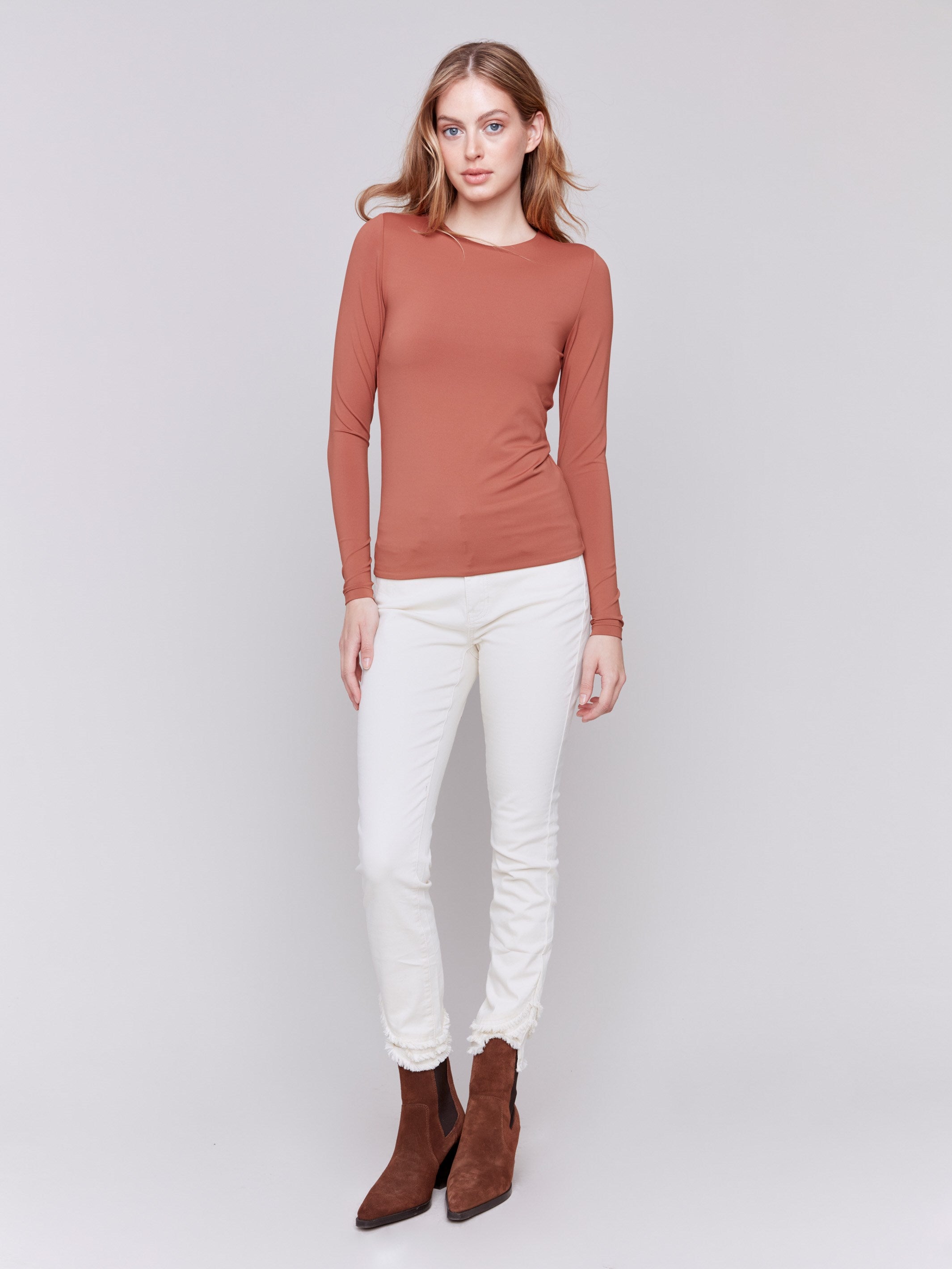 Terracotta long-sleeve top with crew neckline, featuring a fitted silhouette by Charlie B.