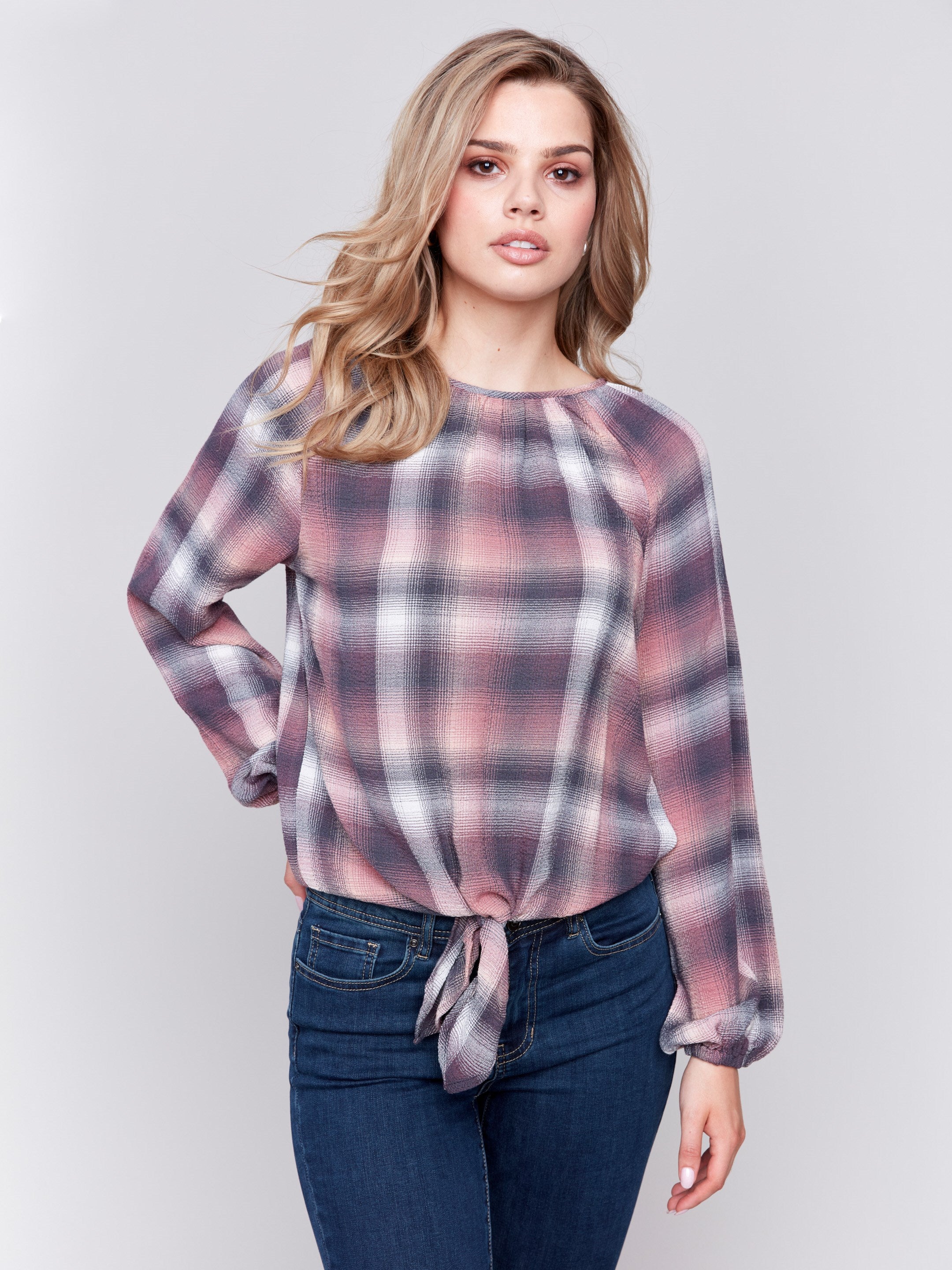 Quartz long-sleeve blouse with balloon sleeves and front tie detail in a plaid check pattern by Charlie B.