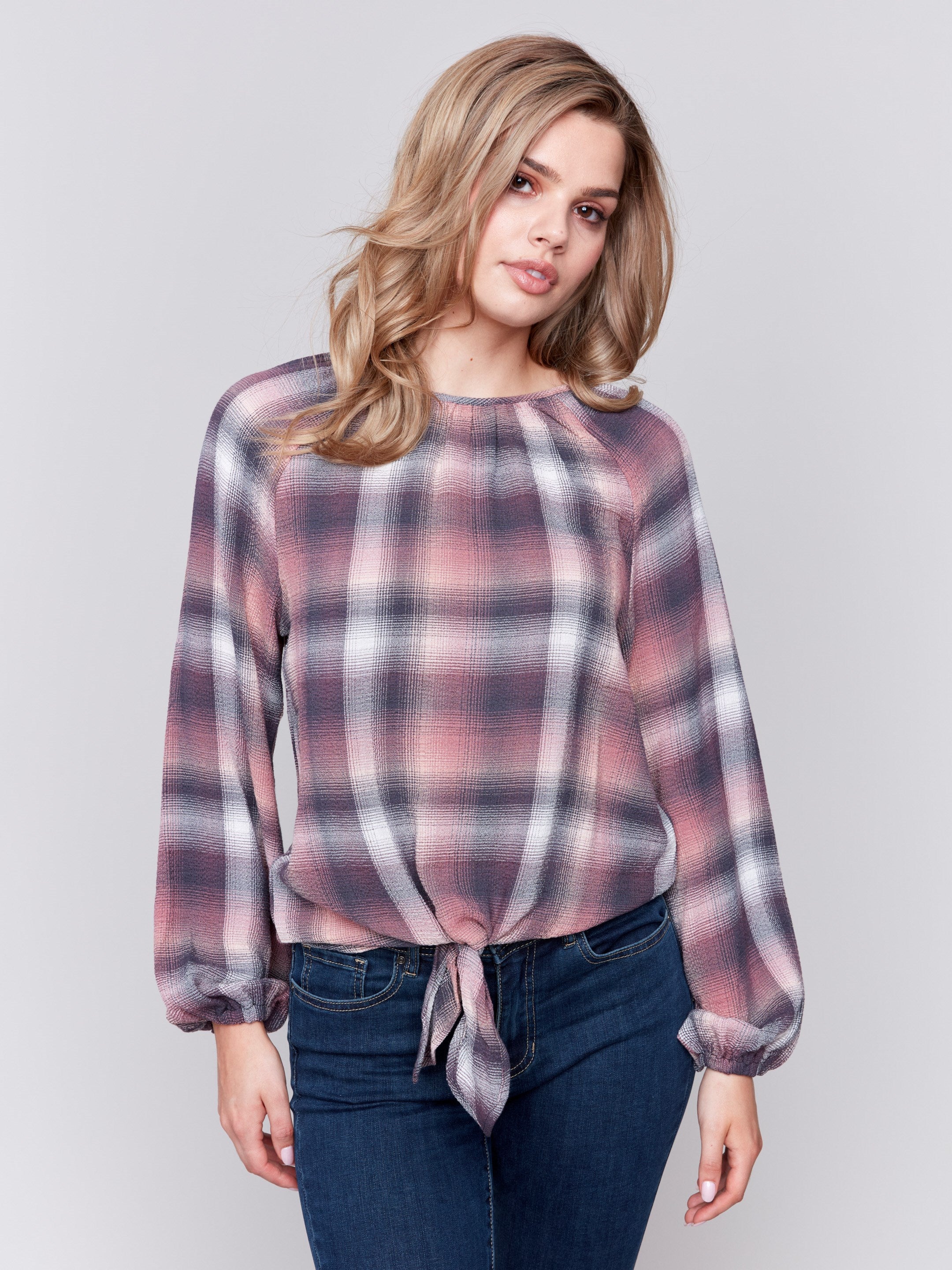 Quartz long-sleeve blouse with balloon sleeves and front tie detail in a plaid check pattern by Charlie B.