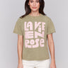 Celadon green t-shirt with a crew neckline, featuring a pink graphic by Charlie B.