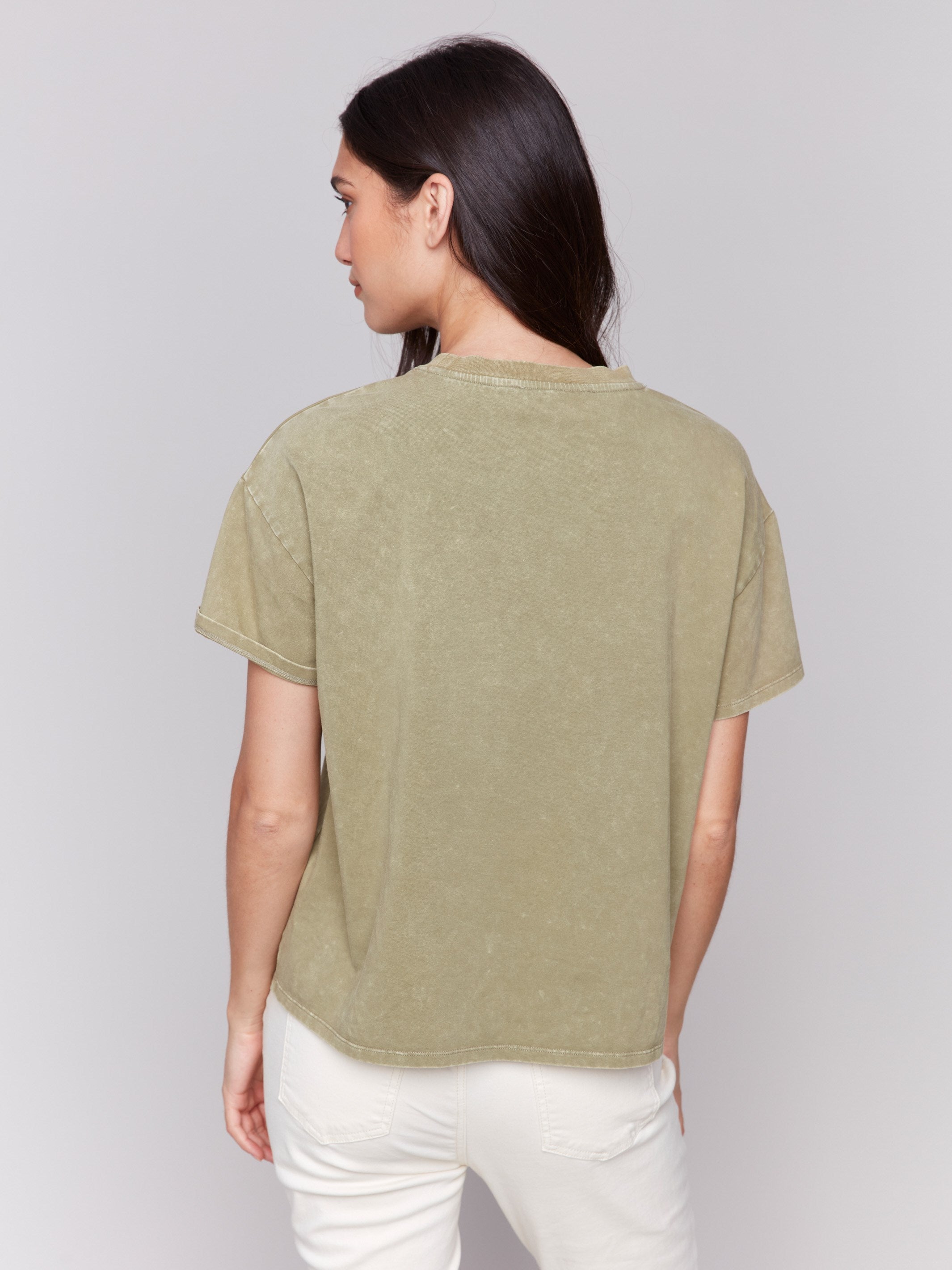 Casual loose-fit tee in celadon with statement graphic print by Charlie B.