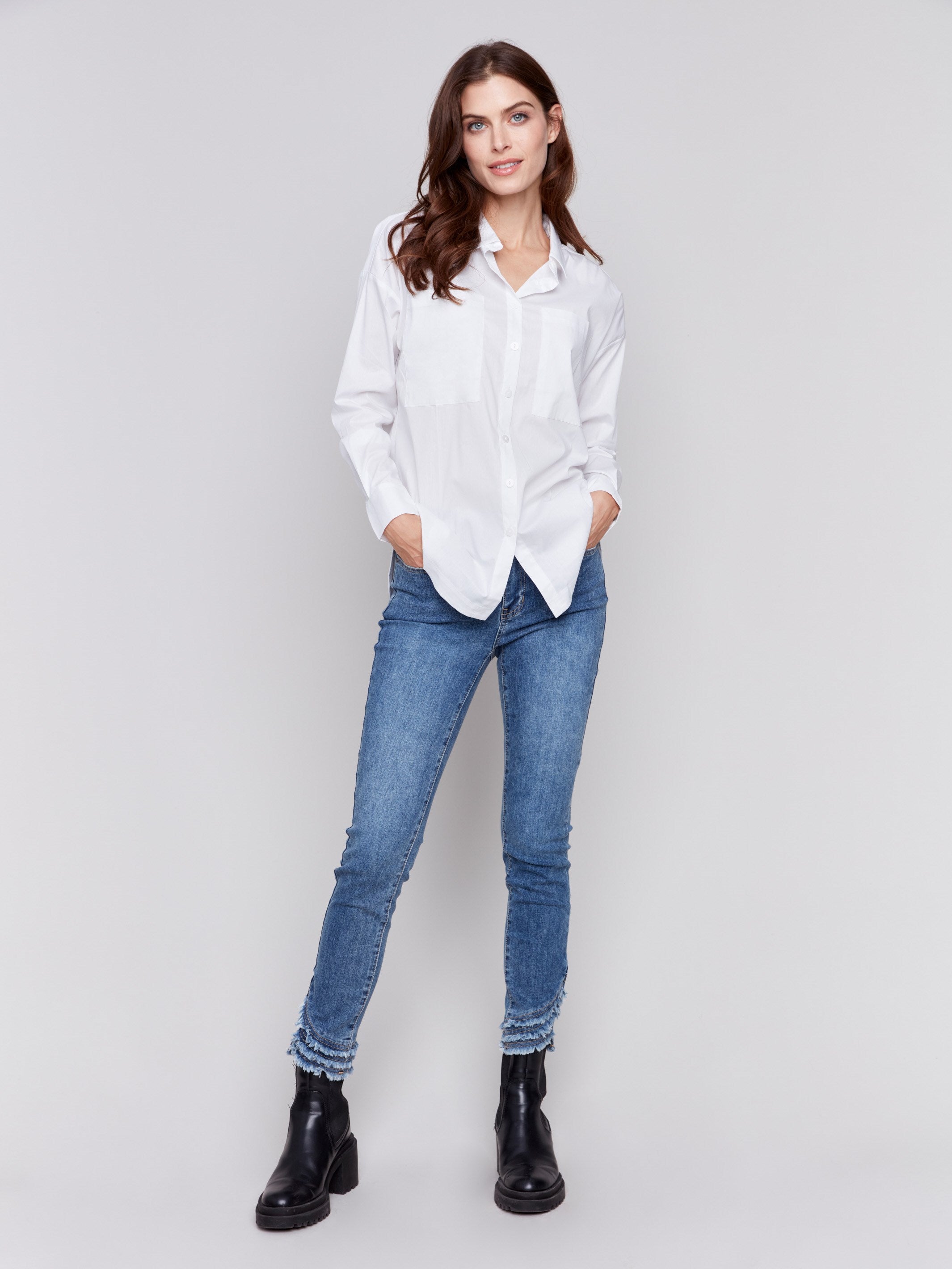 White loose fit poplin shirt with drop shoulders, rounded hem, and patch pockets by Charlie B.