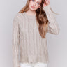 Champagne colored metallic cable knit sweater with a crew neck and long sleeves by Charlie B.