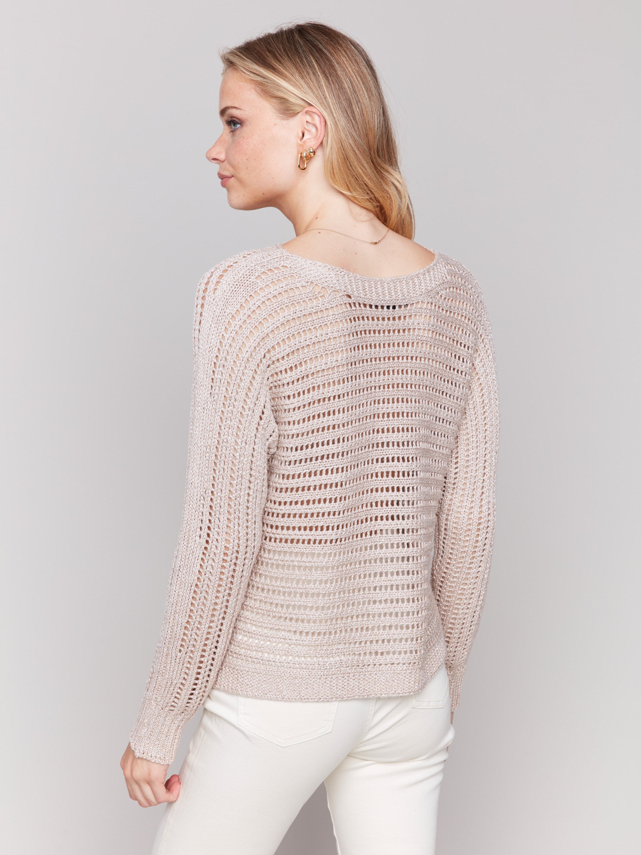 Stylish champagne crew neck sweater with intricate detailing by Charlie B.