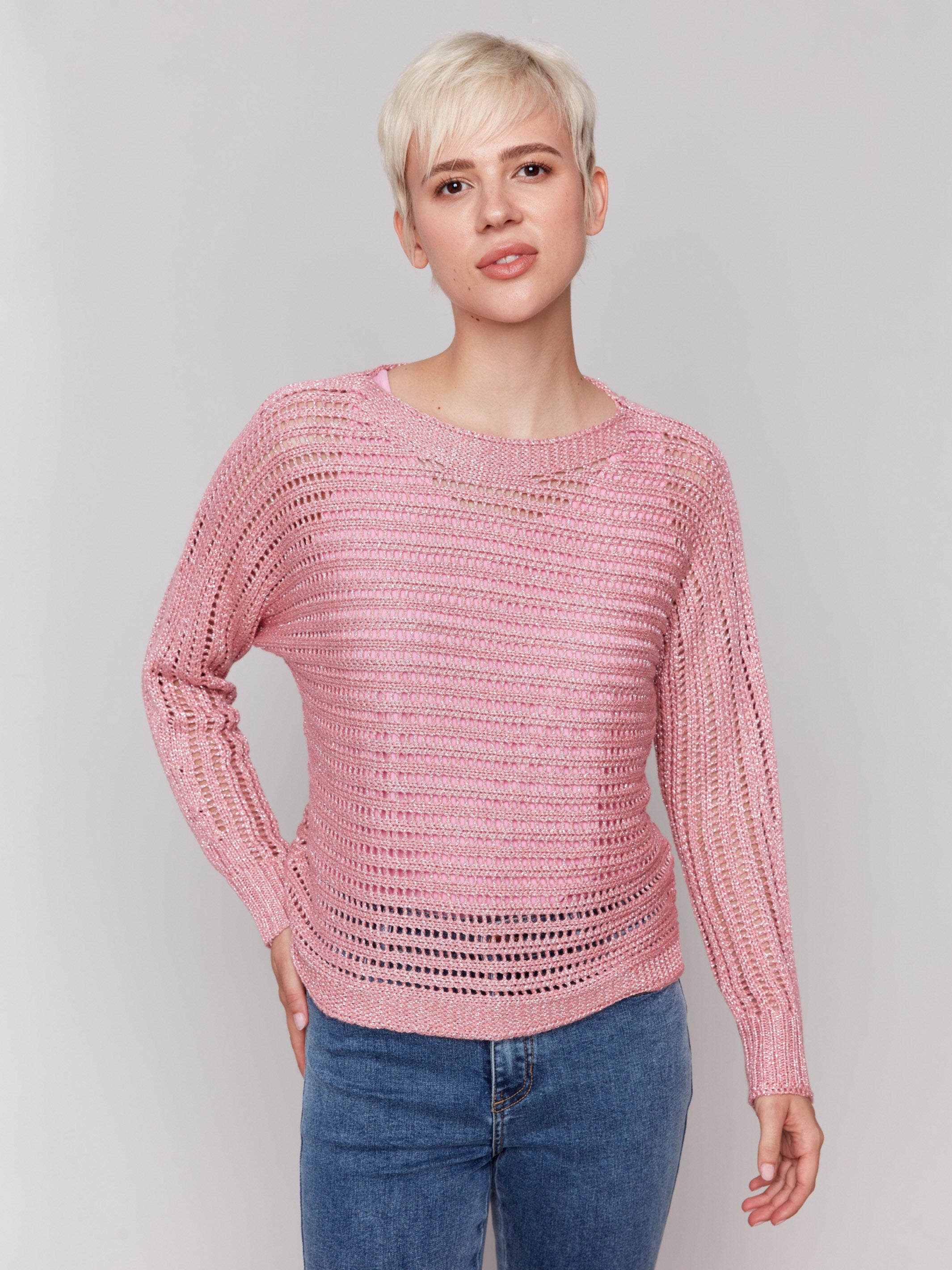 Pink sweater with long dolman sleeves and a stylish design by Charlie B.