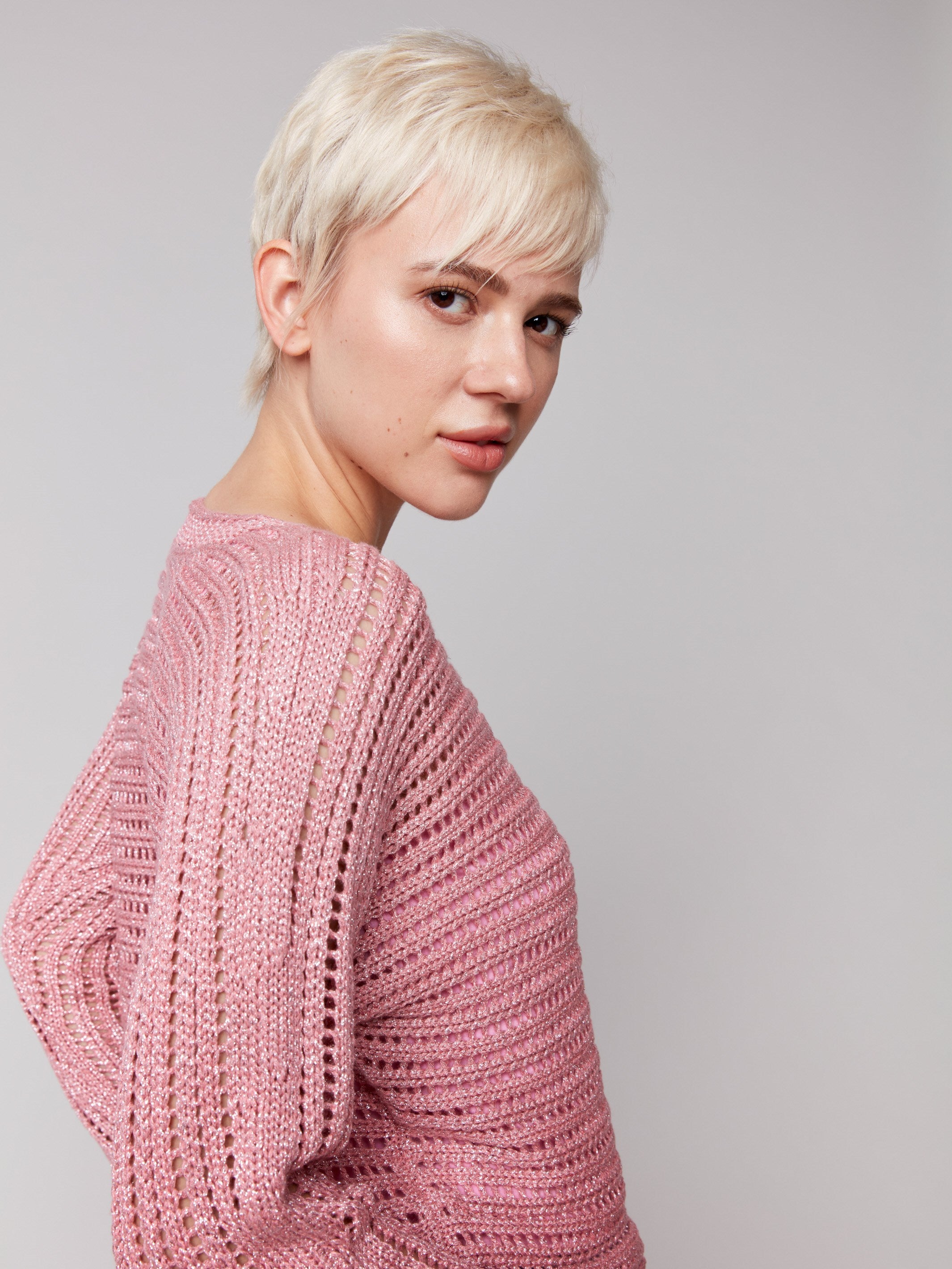 Stylish crew neck pink sweater with eye-catching details by Charlie B.