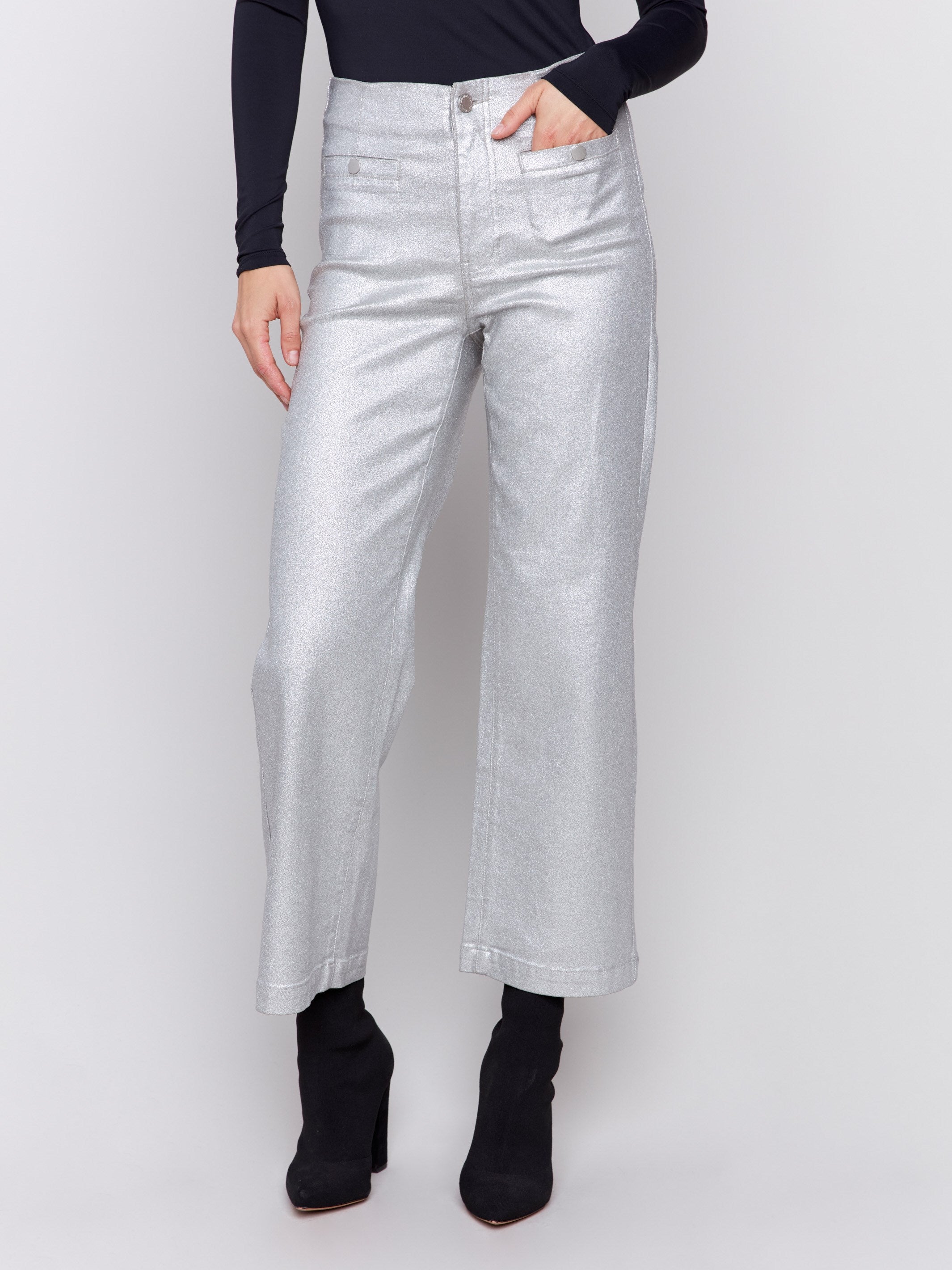 Silver metallic flared pants with welt front pockets and zipper closure by Charlie B.