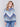 Denim-colored long-sleeve sweater with chevron stripes in blue, grey, and white. Crew neckline and ribbed cuffs by Charlie B.