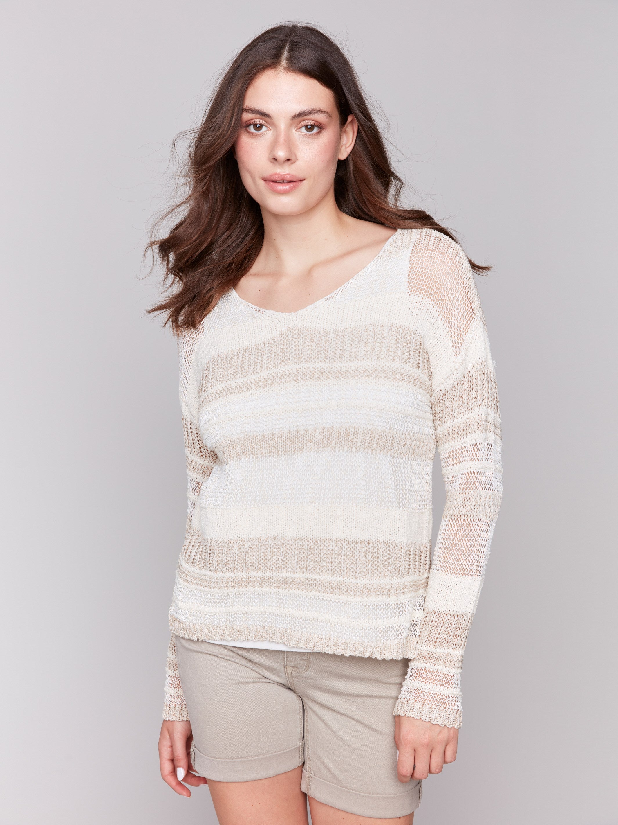 Beige sweater with a rounded V-neck and drop shoulders by Charlie B.