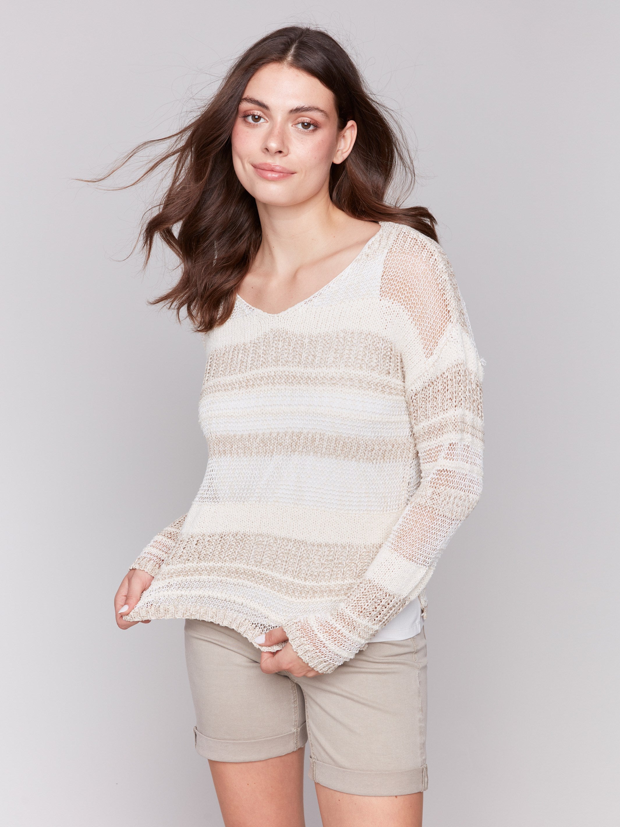 Long-sleeve beige sweater with a unique striped design by Charlie B.