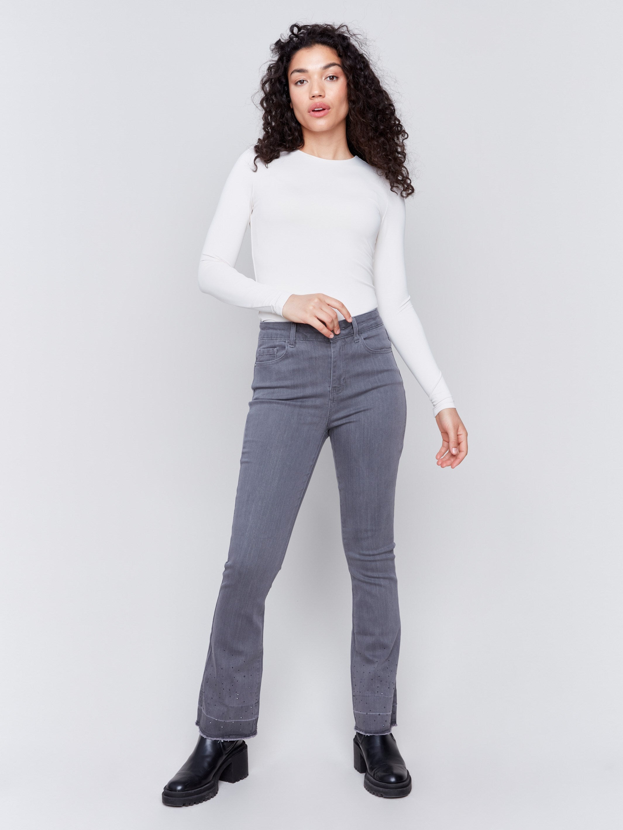 Medium grey flare jeans with ombre hem and stud detailing, featuring a five-pocket design and a regular rise by Charlie B.