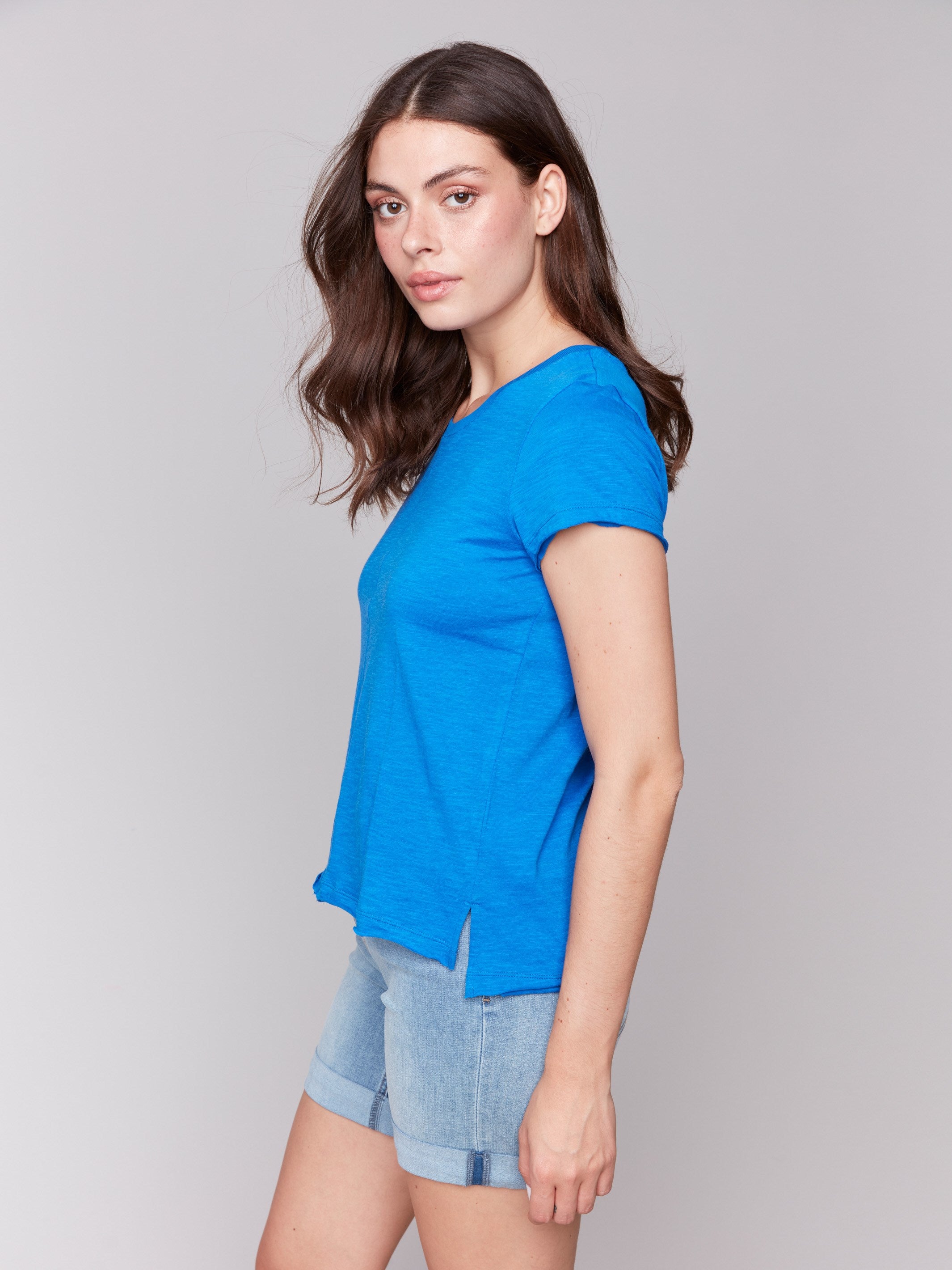 Organic cotton t-shirt in coastal blue with subtle side slits for ease, by Charlie B.