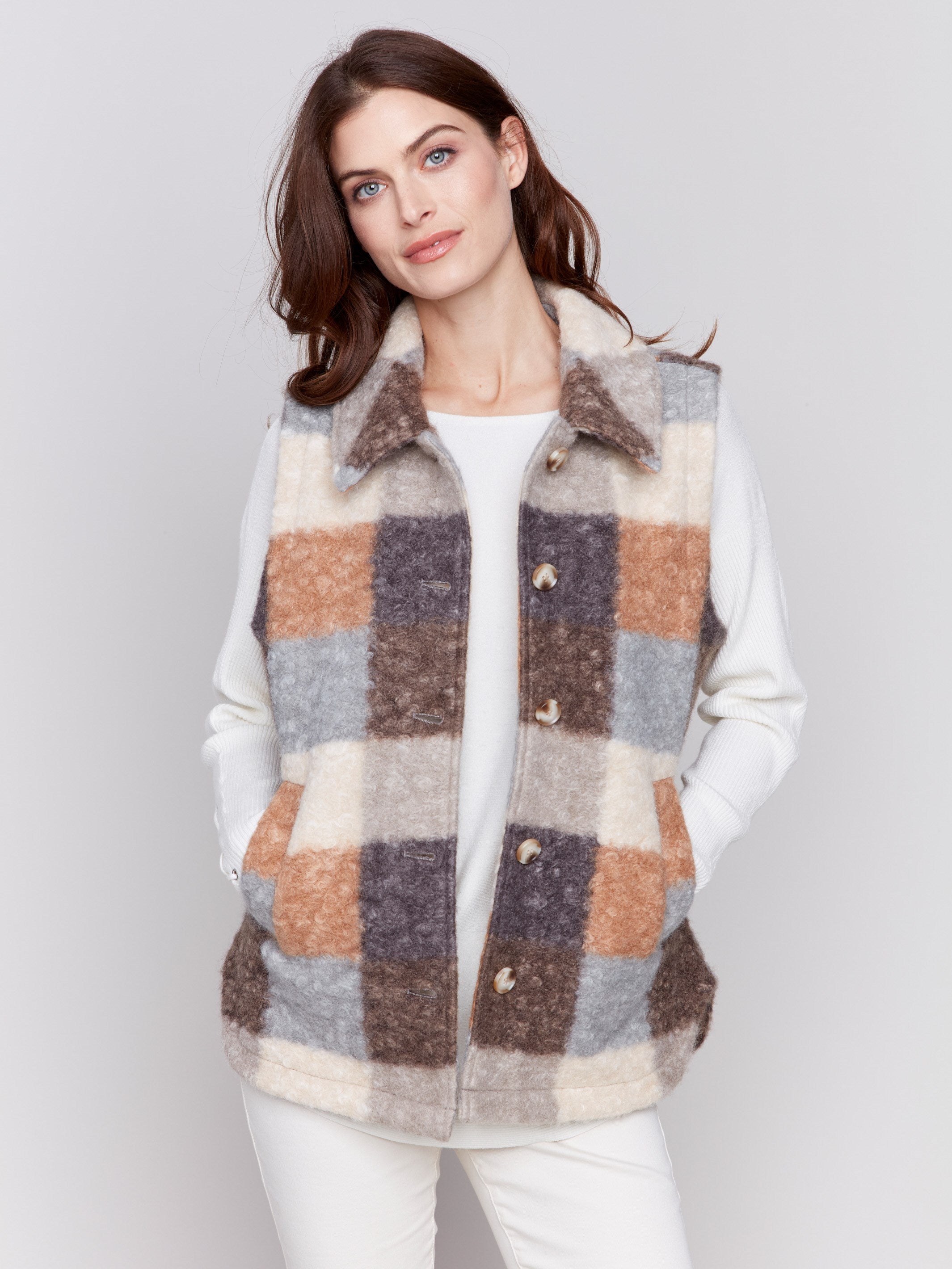 Terracotta colored plaid bouclé knit vest with spread collar and button closure by Charlie B.