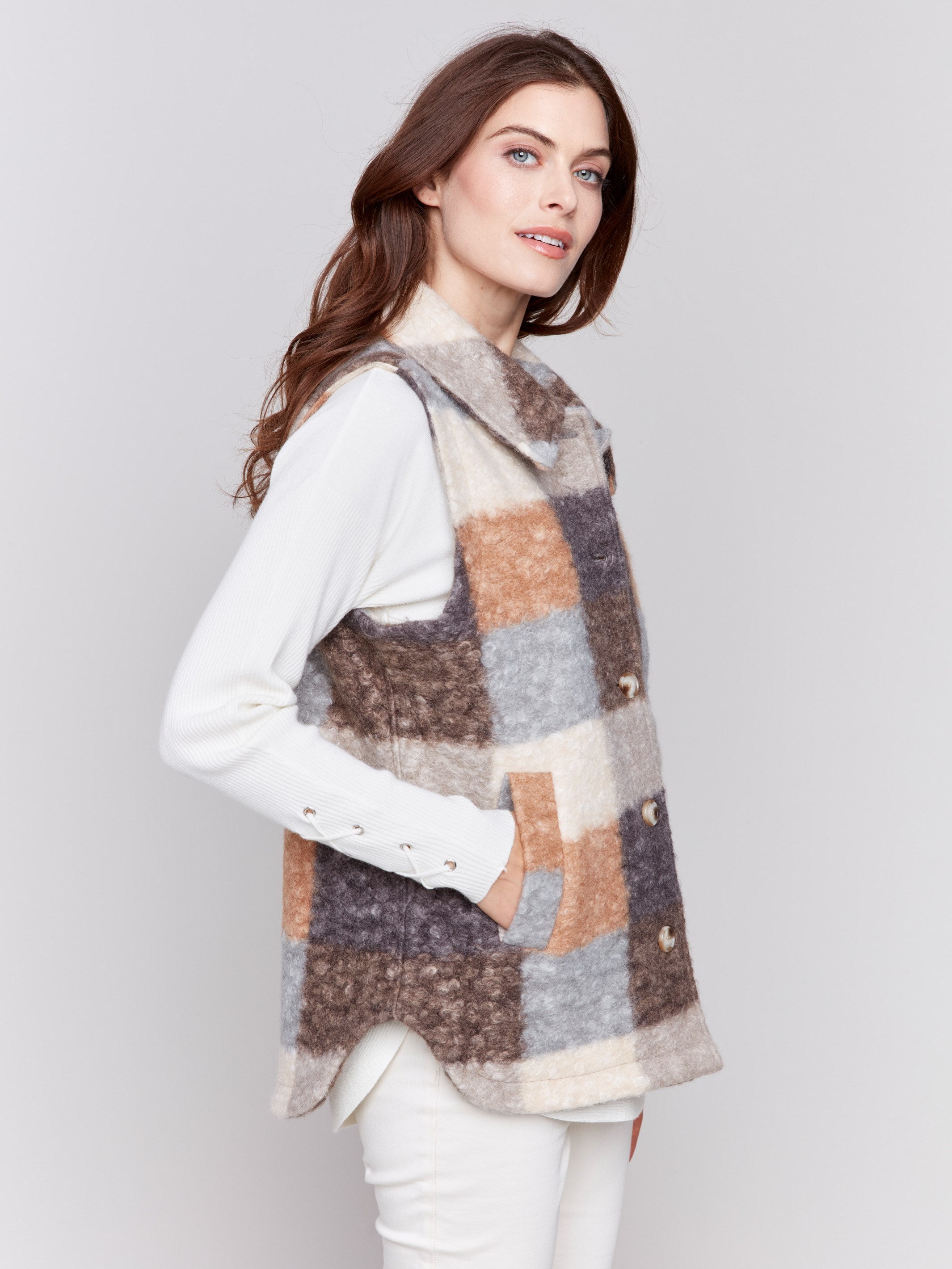 Terracotta colored plaid bouclé knit vest with spread collar and button closure by Charlie B.