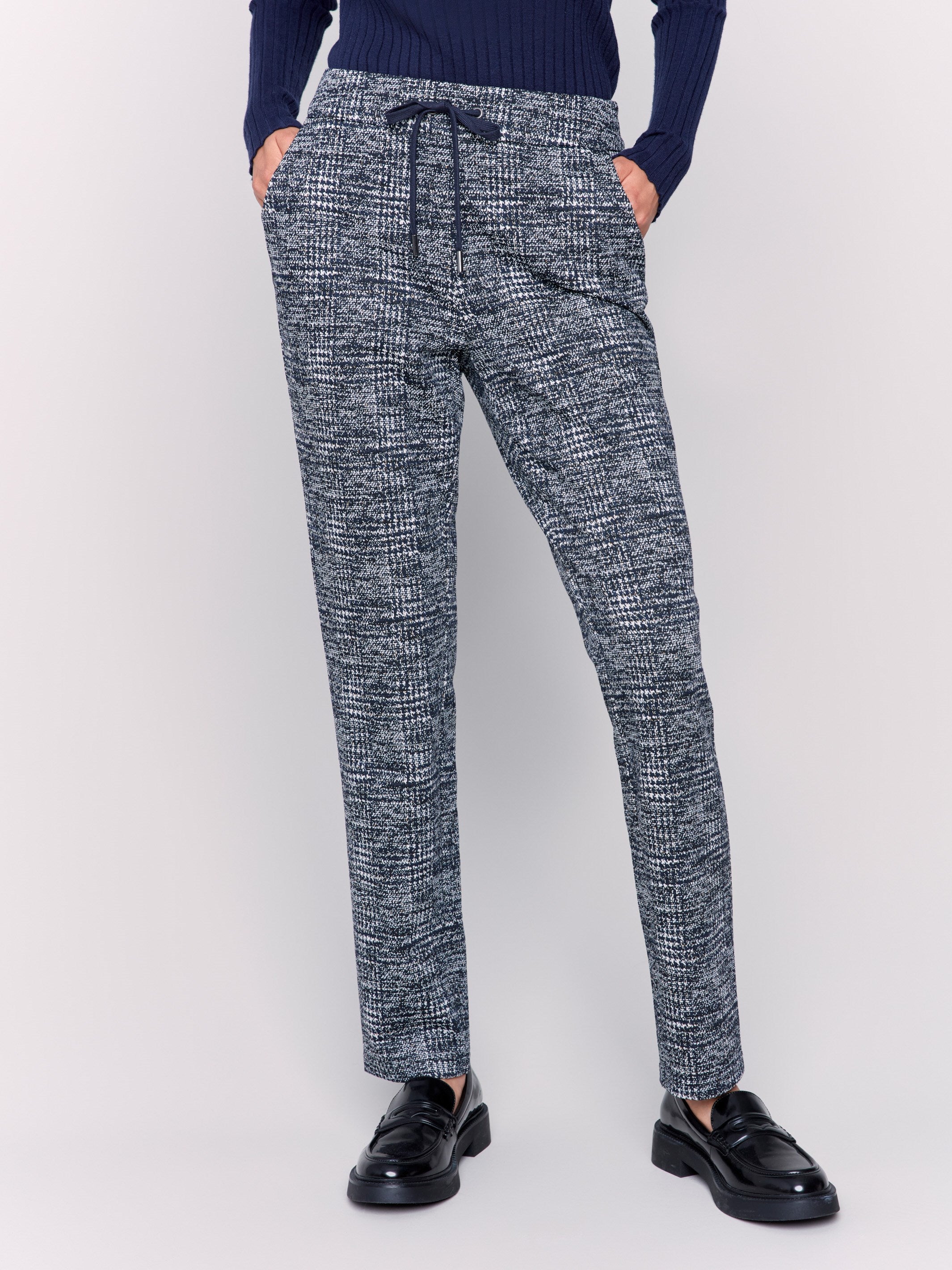 Plaid knit jogger pants in navy with a mid rise and slim leg fit, featuring an adjustable drawstring waist and side pockets by Charlie B.