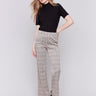 Almond-colored houndstooth plaid pull-on flared pants with high rise and back pockets by Charlie B.