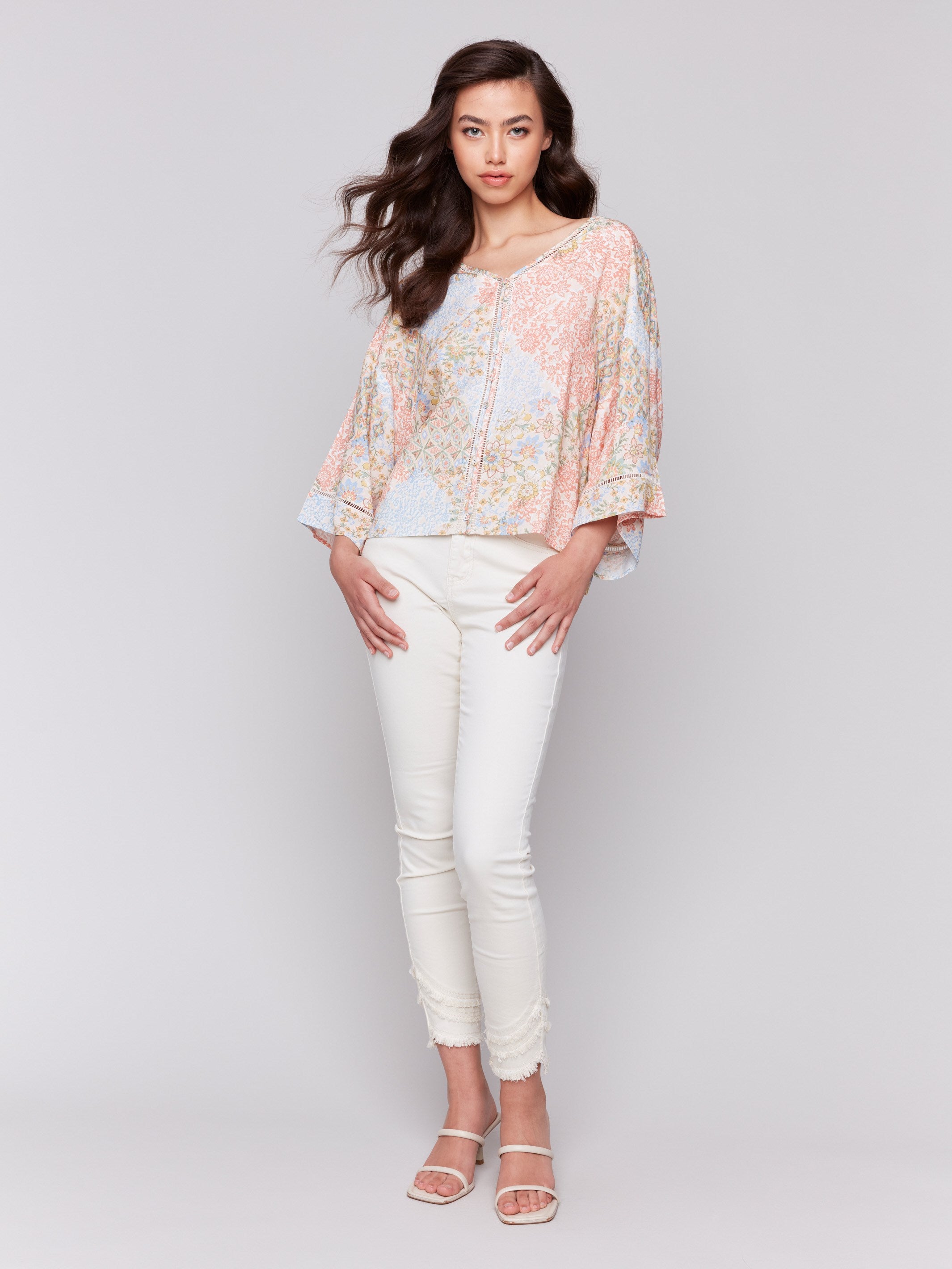 Abstract pattern blouse featuring ladder stitch details by Charlie B.