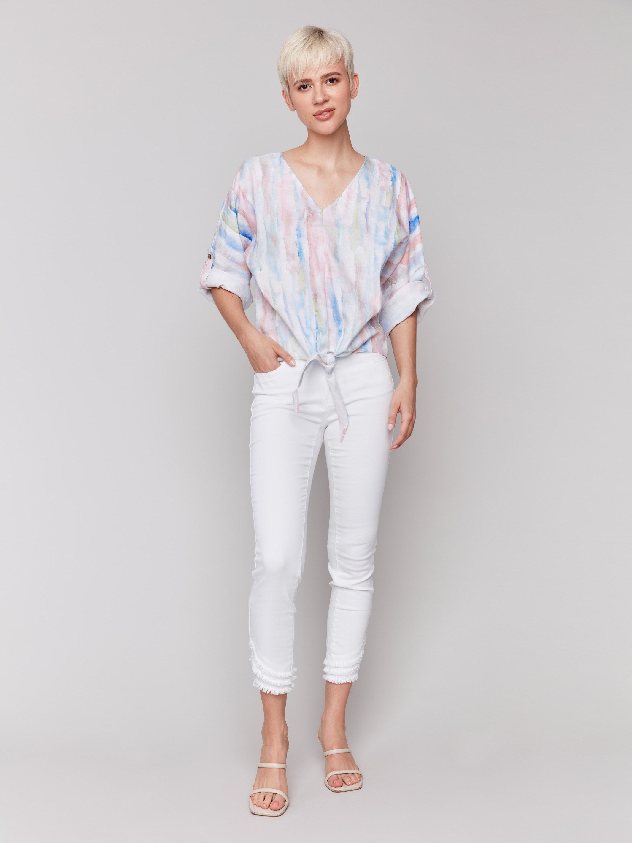 Chic front tie knot at hem on watercolor print top by Charlie B.