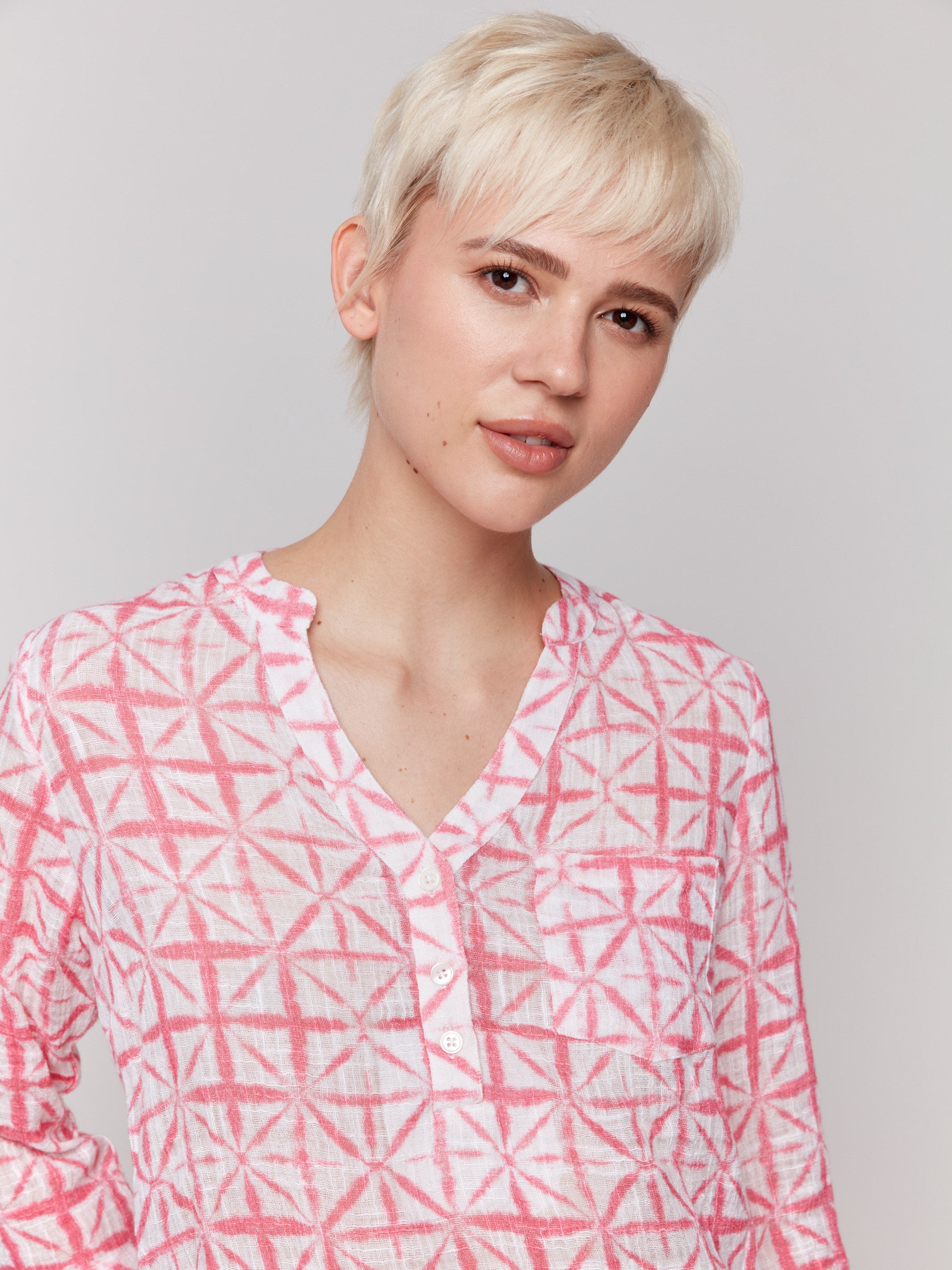 Blouse featuring adjustable 3/4 roll-up sleeves in an abstract print by Charlie B.