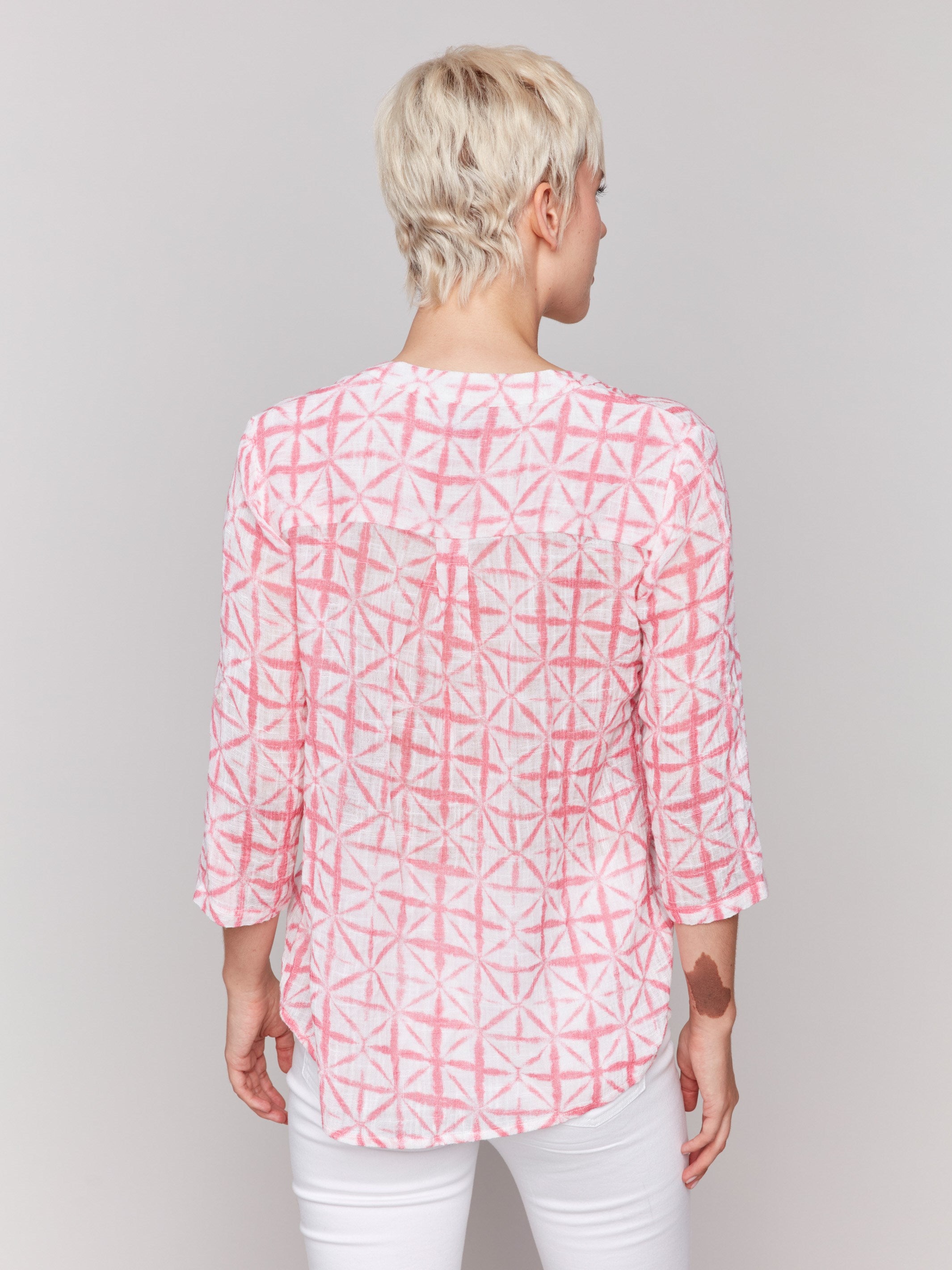 Chic blouse with a chest pocket, showcasing modern geometric patterns by Charlie B.