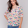 Blouse with Mao collar and vibrant floral pattern by Charlie B.