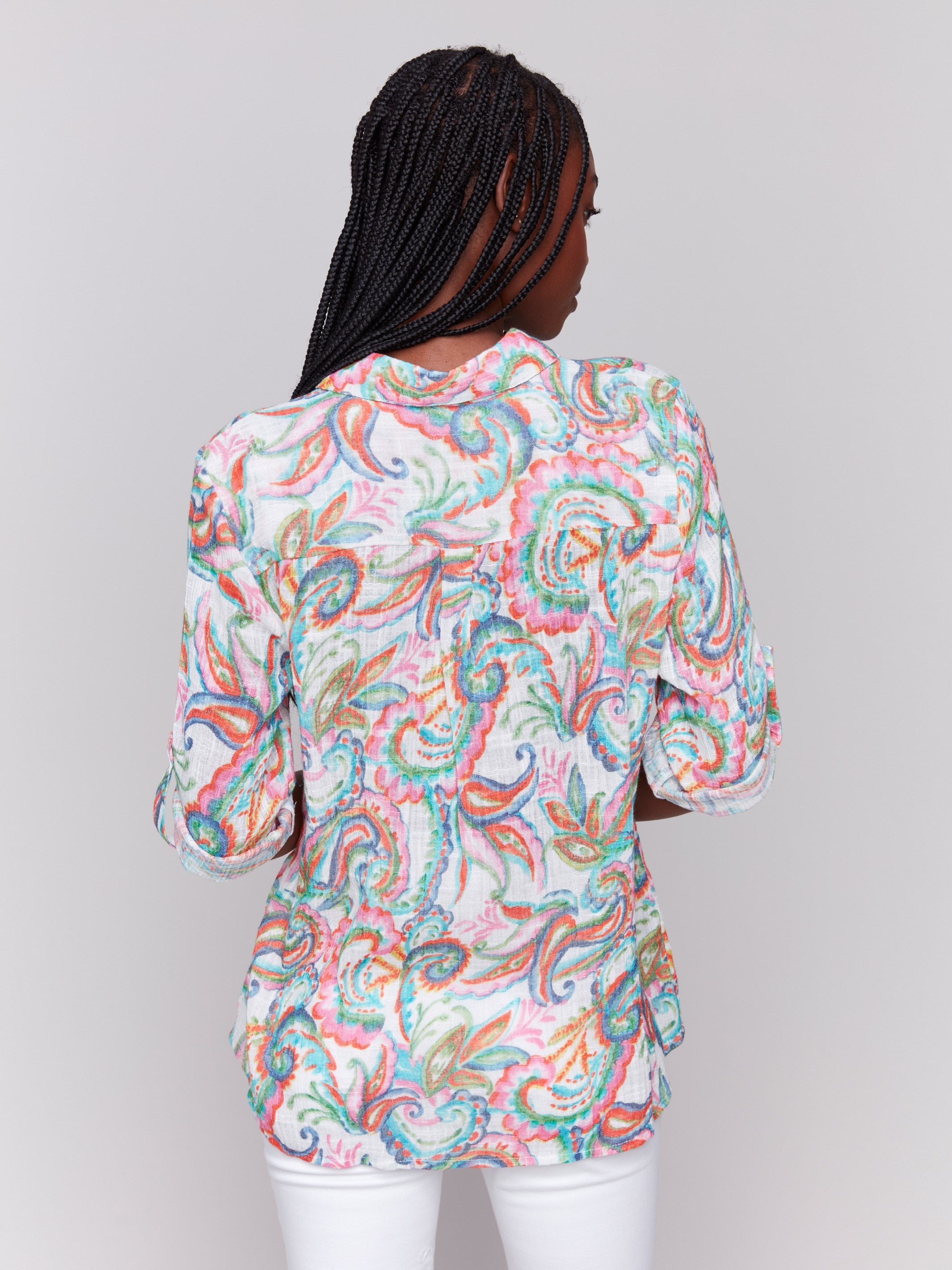 Button front closure adds elegance to this patterned shirt by Charlie B.