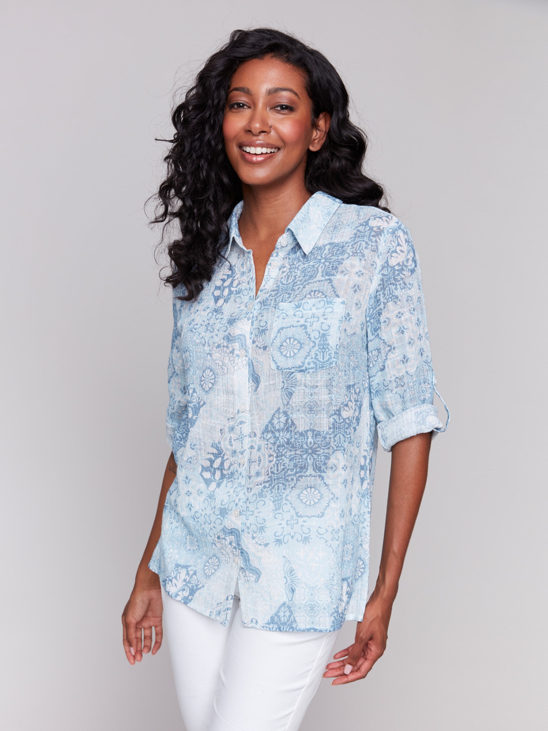 Light blue shirt with a shirt collar and an abstract pattern by Charlie B.