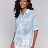 Light blue shirt with a shirt collar and an abstract pattern by Charlie B.