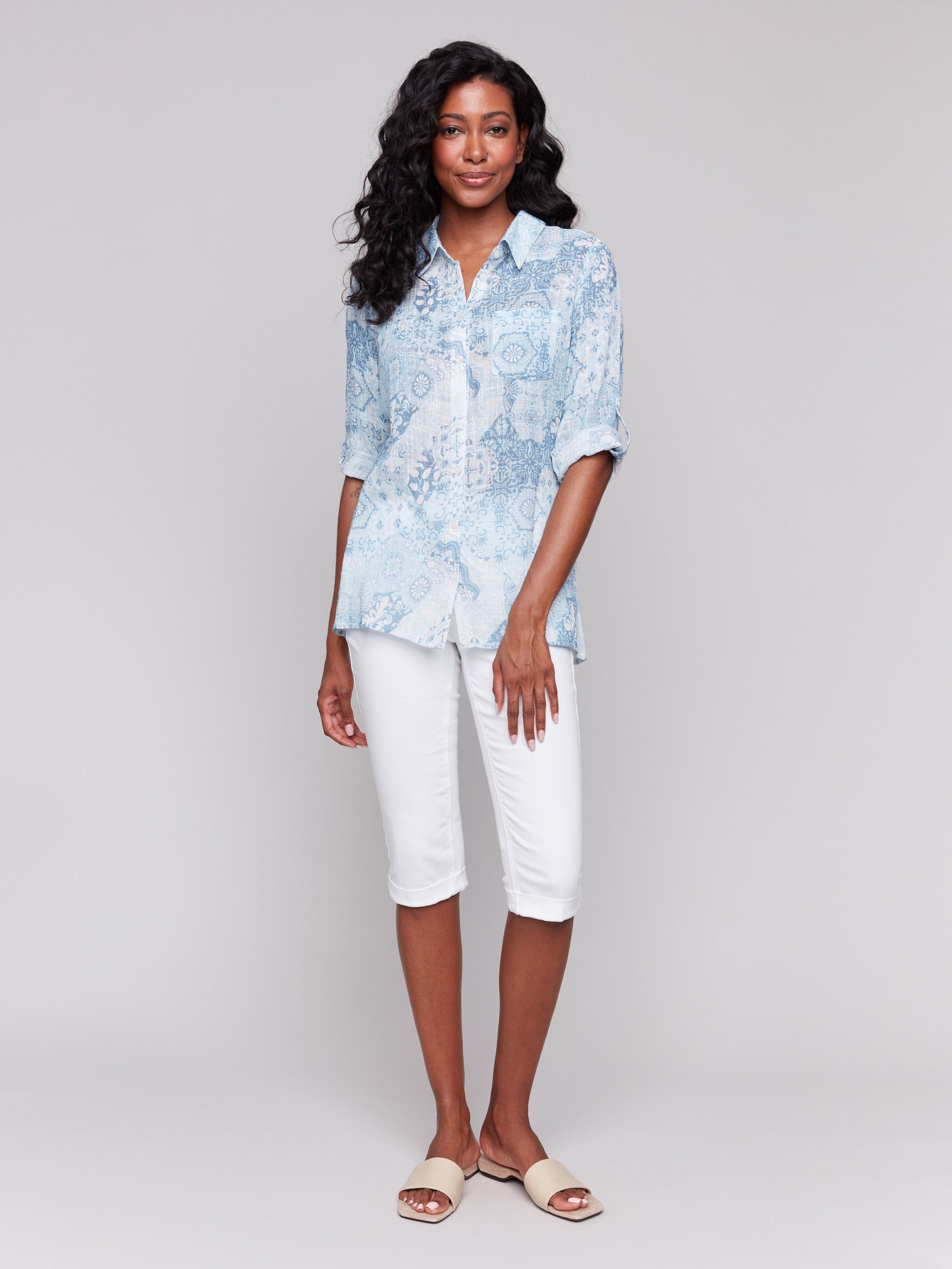 Stylish light blue shirt with button front closure by Charlie B.