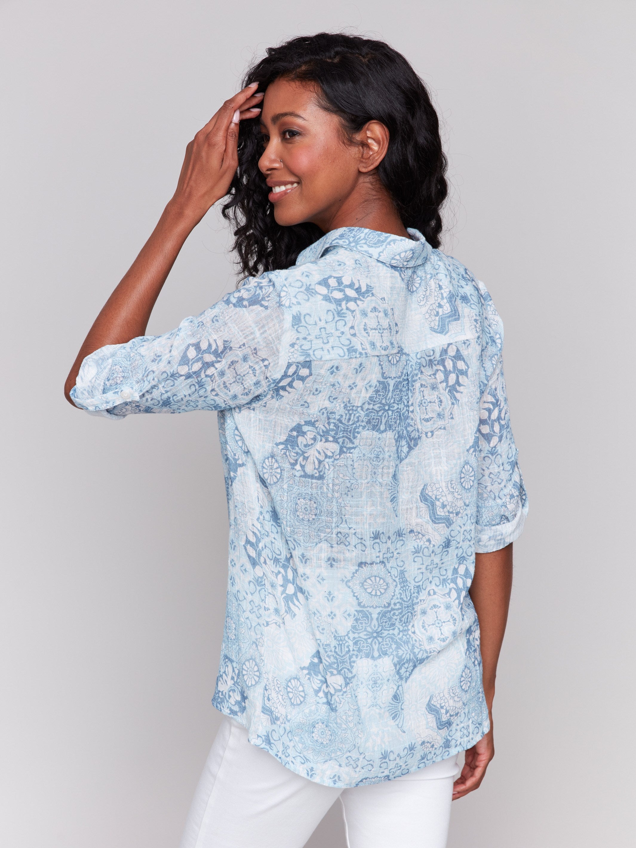 Printed long sleeve blue shirt showcasing an abstract design by Charlie B.