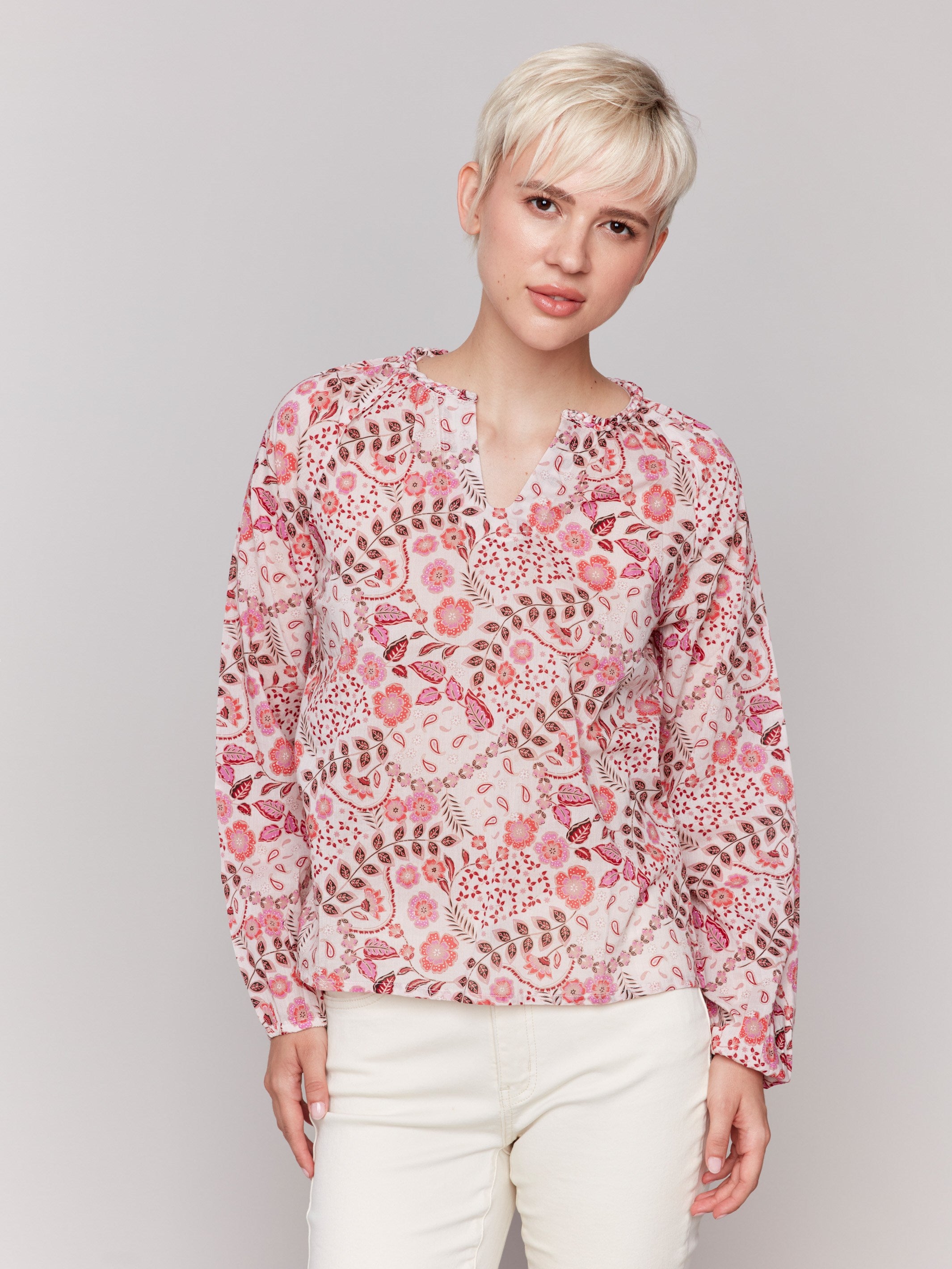 Long-sleeve blouse featuring a unique floral design by Charlie B.