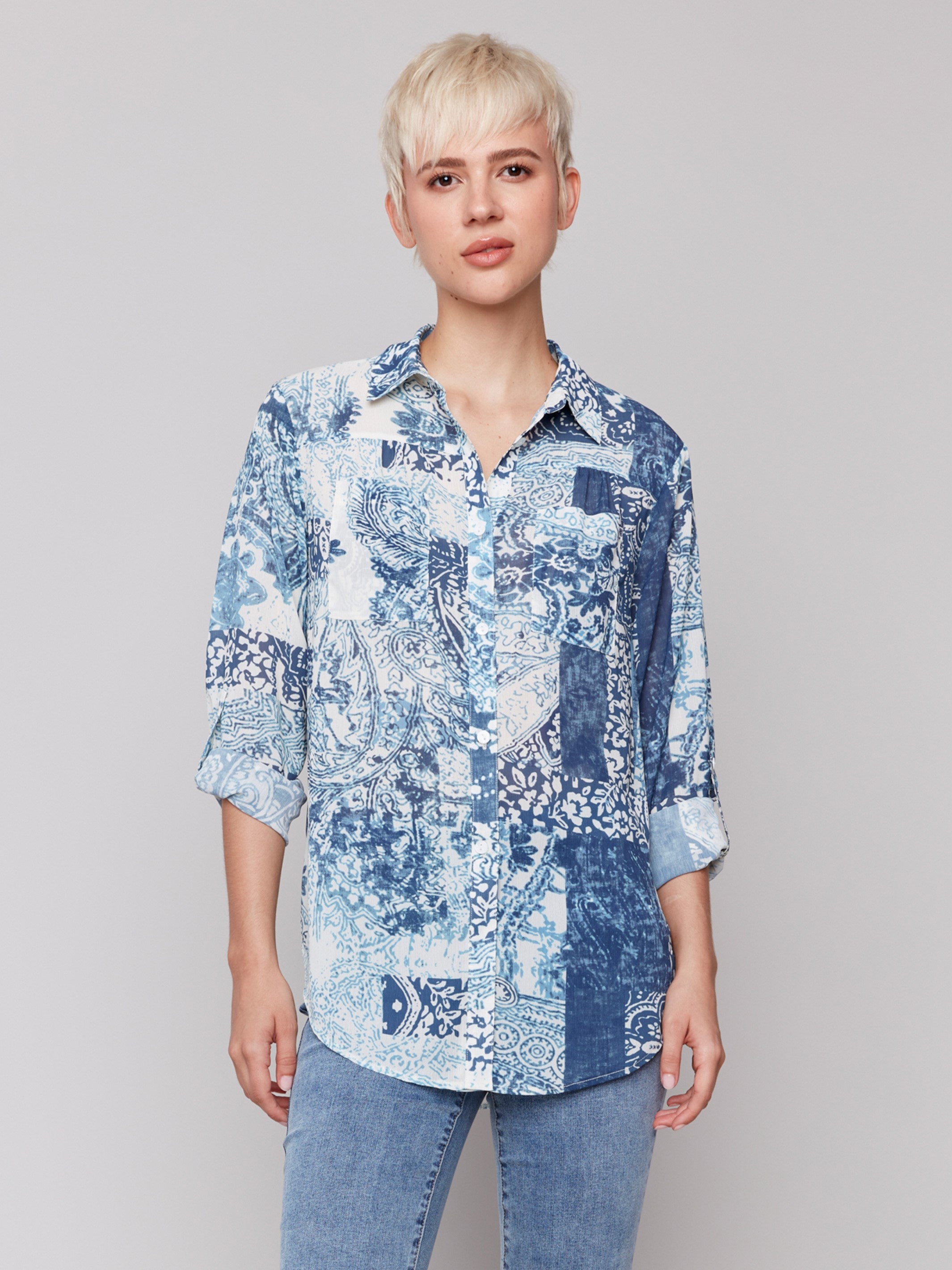 Printed crinkle chiffon georgette blouse with shirt collar and patch pockets in abstract blue bandana design by Charlie B.