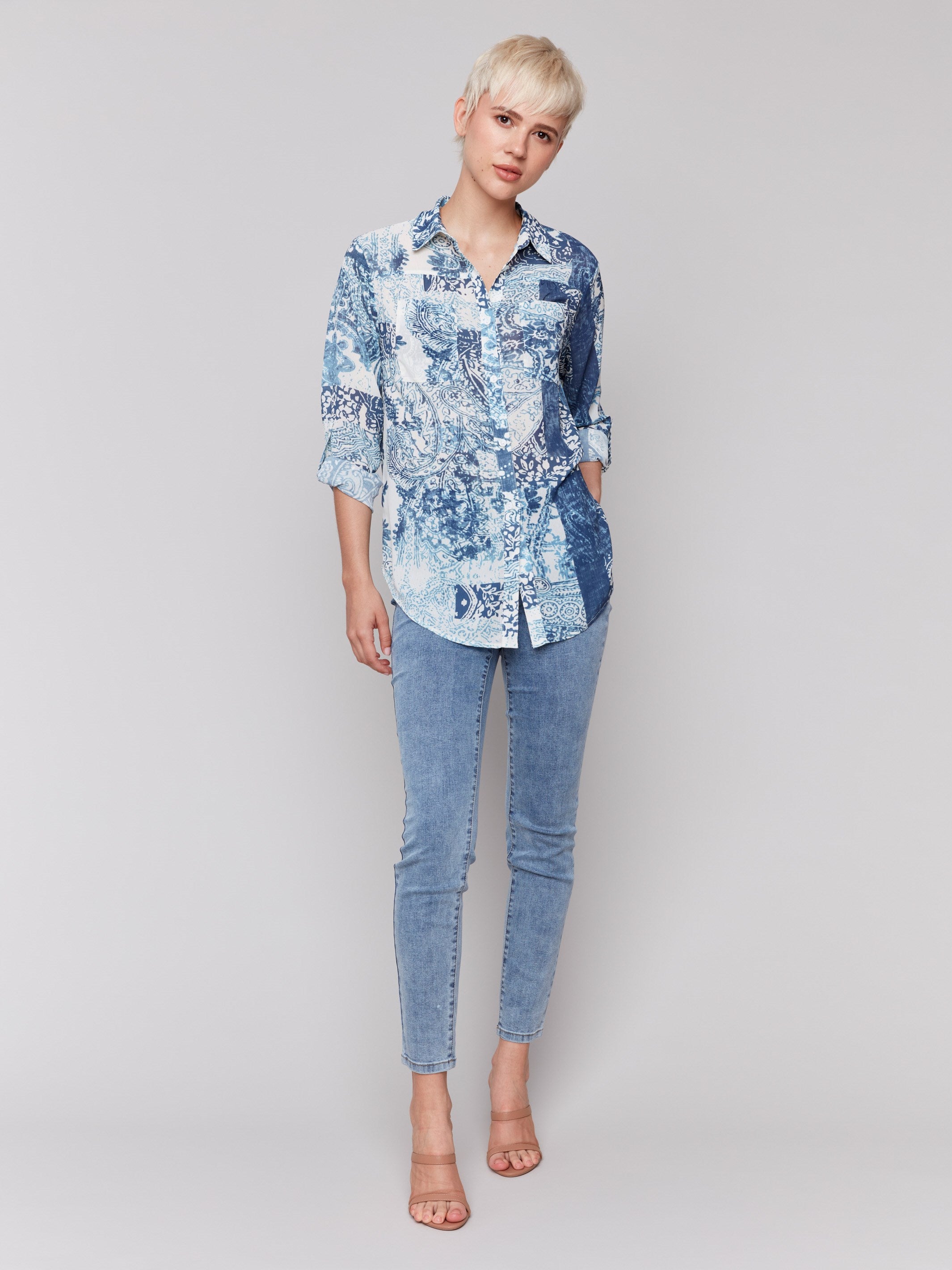 Printed crinkle chiffon georgette blouse with shirt collar and patch pockets in abstract blue bandana design by Charlie B.