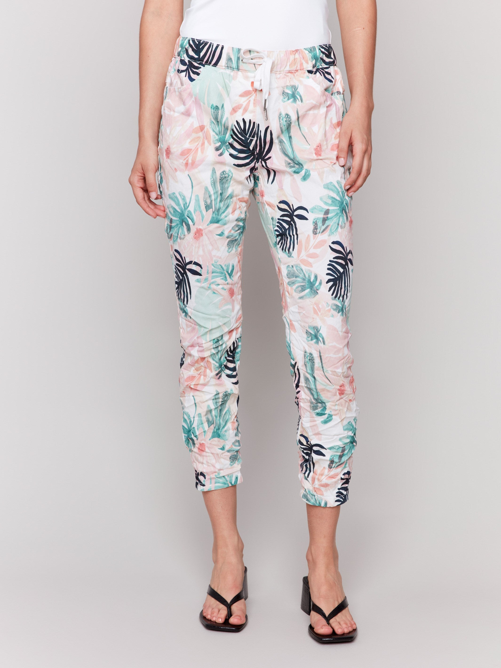 Cropped length floral joggers featuring a stretch fabric for comfort by Charlie B.